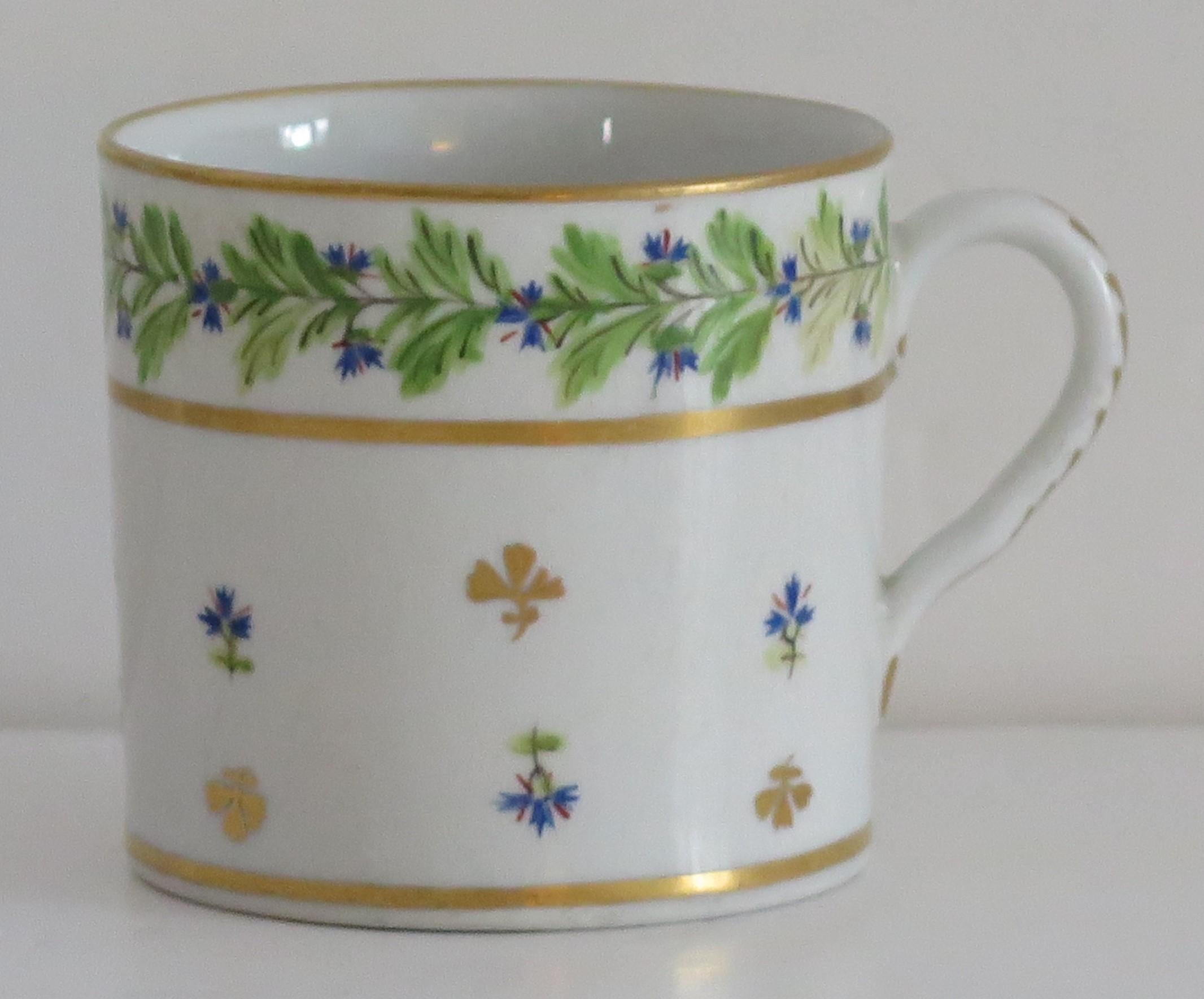 This is a good quality coffee can that we attribute to the Coalport porcelain works, Shropshire, England, made during the John Rose period of the George 111rd years, circa 1805.

The coffee can is nominally parallel, tapering slightly to the base,