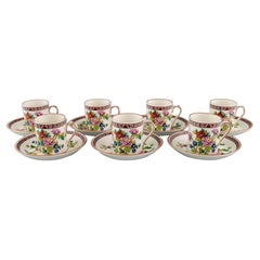 Coalport, England. Seven Flower of Tibet chocolate cups with saucers.