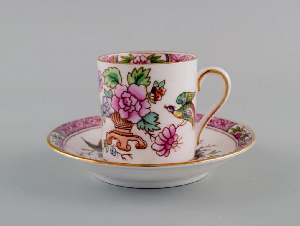 Coalport, England. Twelve Tuscan coffee cups with saucers decorated with flowers and gold edge. 
1930's.
The cup measures: 5.7 x 5 cm.
Saucer diameter: 11.3 cm.
In excellent condition.
Stamped.