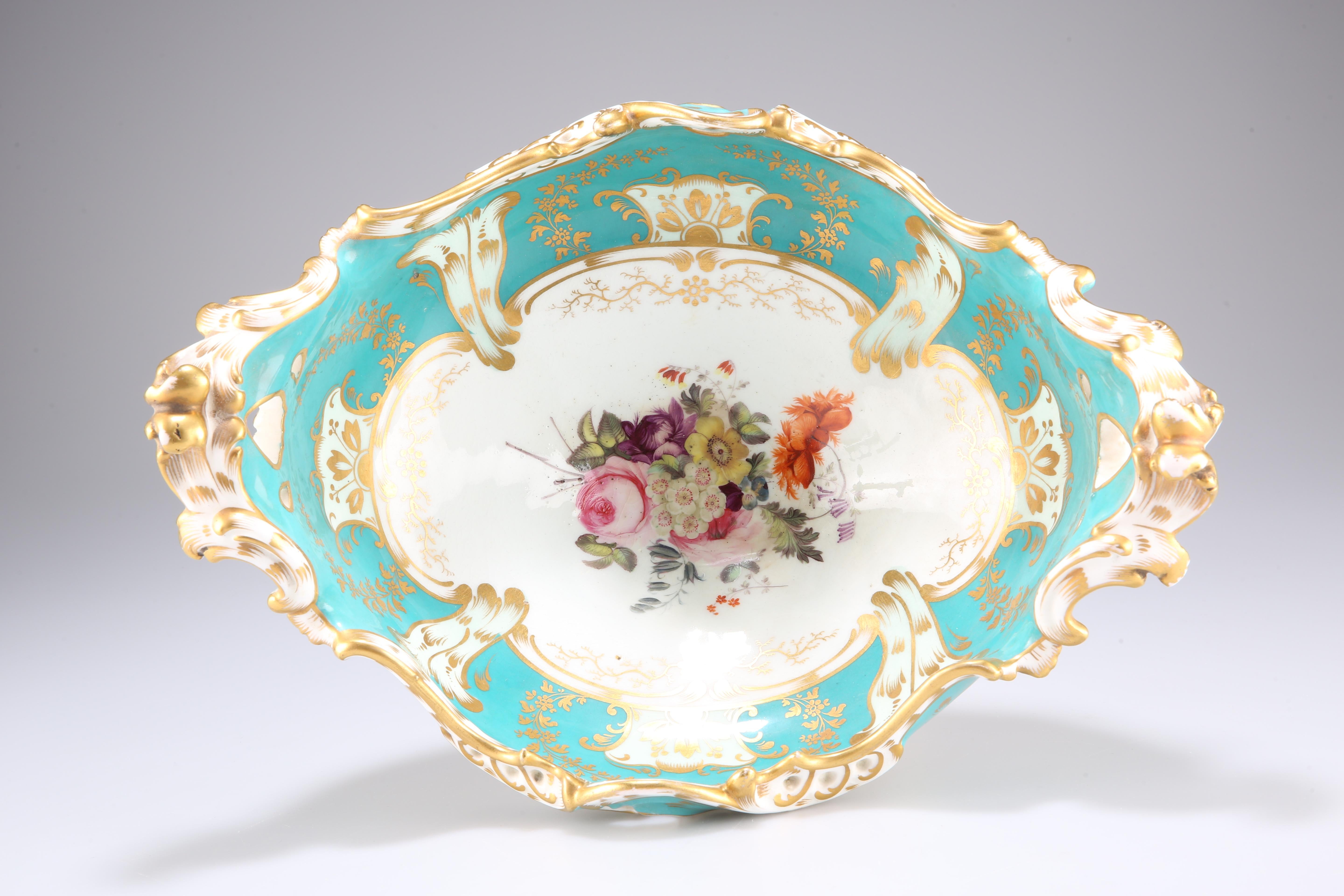 A Coalport English stunning gilded centrepiece dates back to mid 19th century. The shaped oval bowl with pierced edge features all hand painted flower studies, raised on a similarly decorated pierced foot. Its unusual color makes an impressive