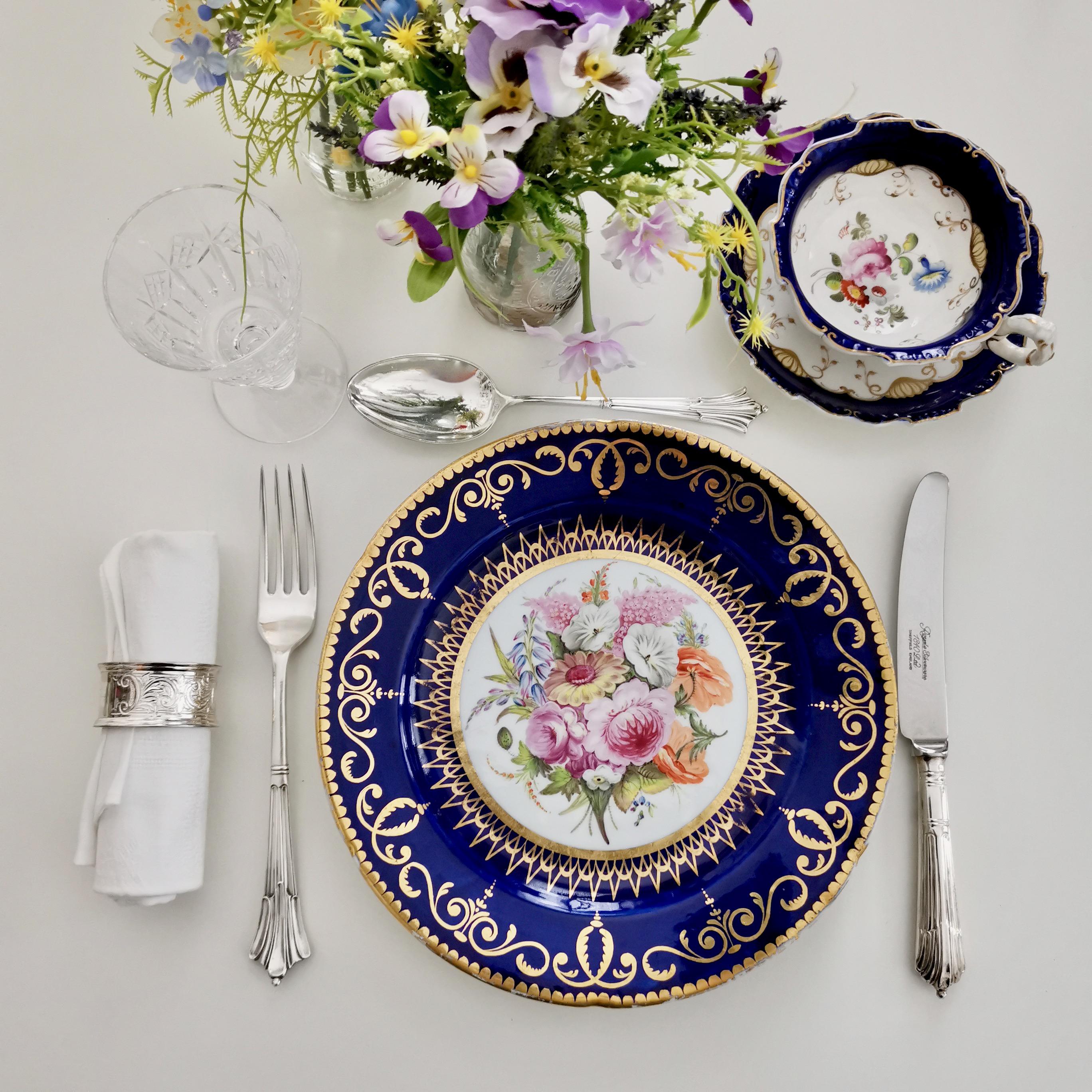 This is a very rare plate made by John Rose in Coalport in about 1805. The plate has a beautiful cobalt blue ground, rich gilding and a stunning flower painting in the centre. There are still a few plates of this service around (I had one a while