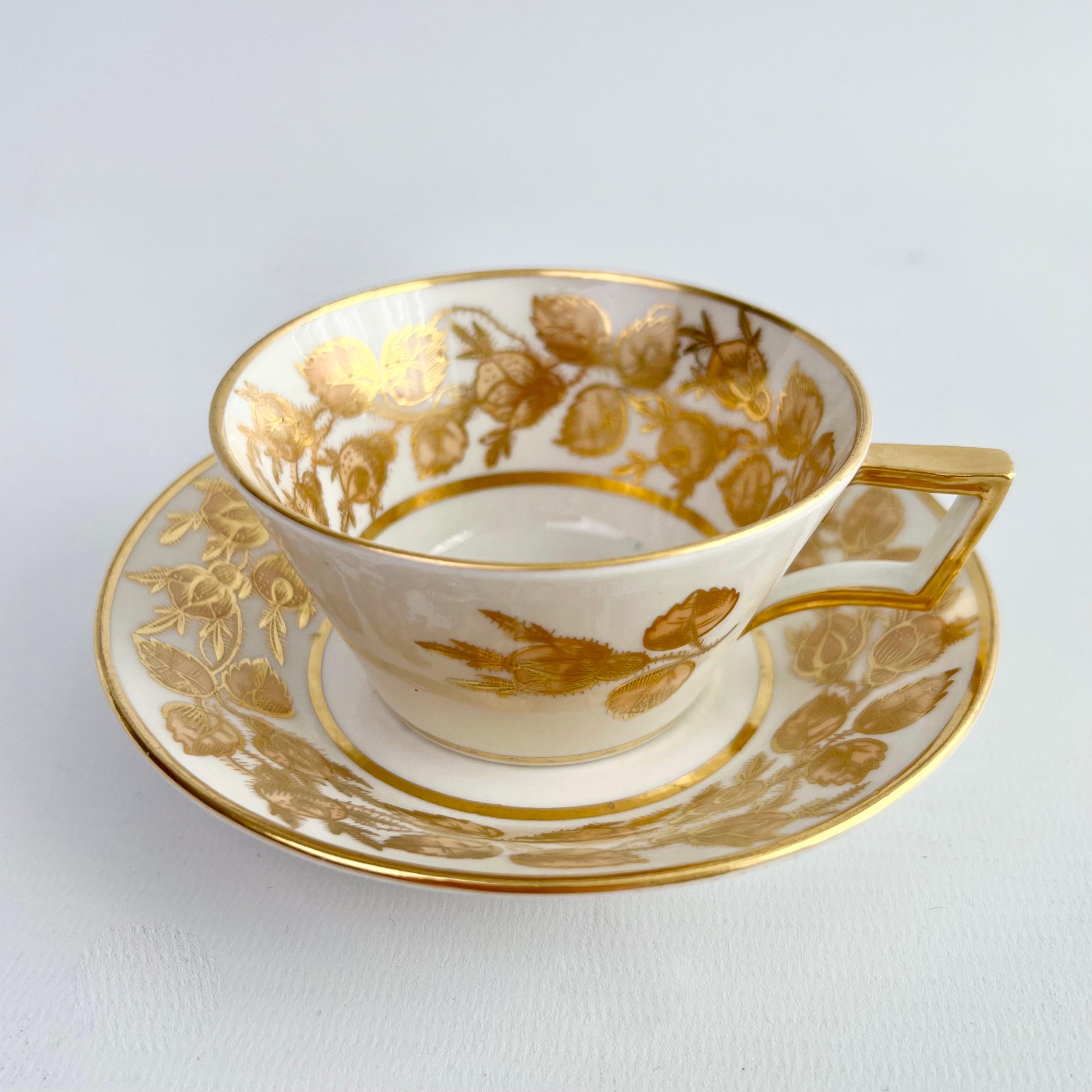 This is a beautiful true trio consisting of a teacup, a coffee cup and a saucer, made by Coalport in about 1810, which was the Regency era. The set is potted in the bucket shape with a 