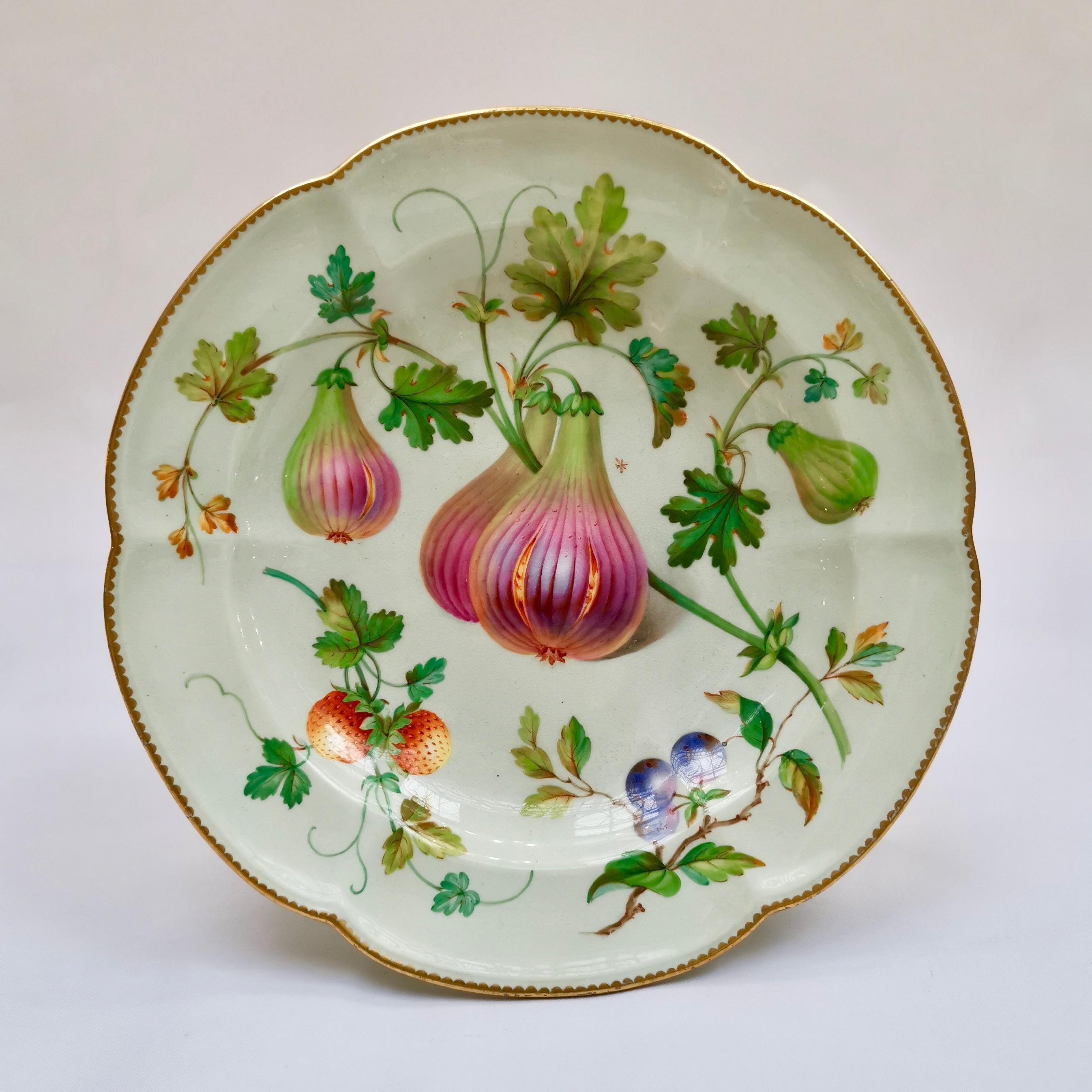 This is a stunning set of a high footed tazza and two plates, made by Coalport between 1850 and 1865. At this time, the Coalport factory was called John Rose & Co, Coalbrookdale. This set would have belonged to a large dessert service. The items are
