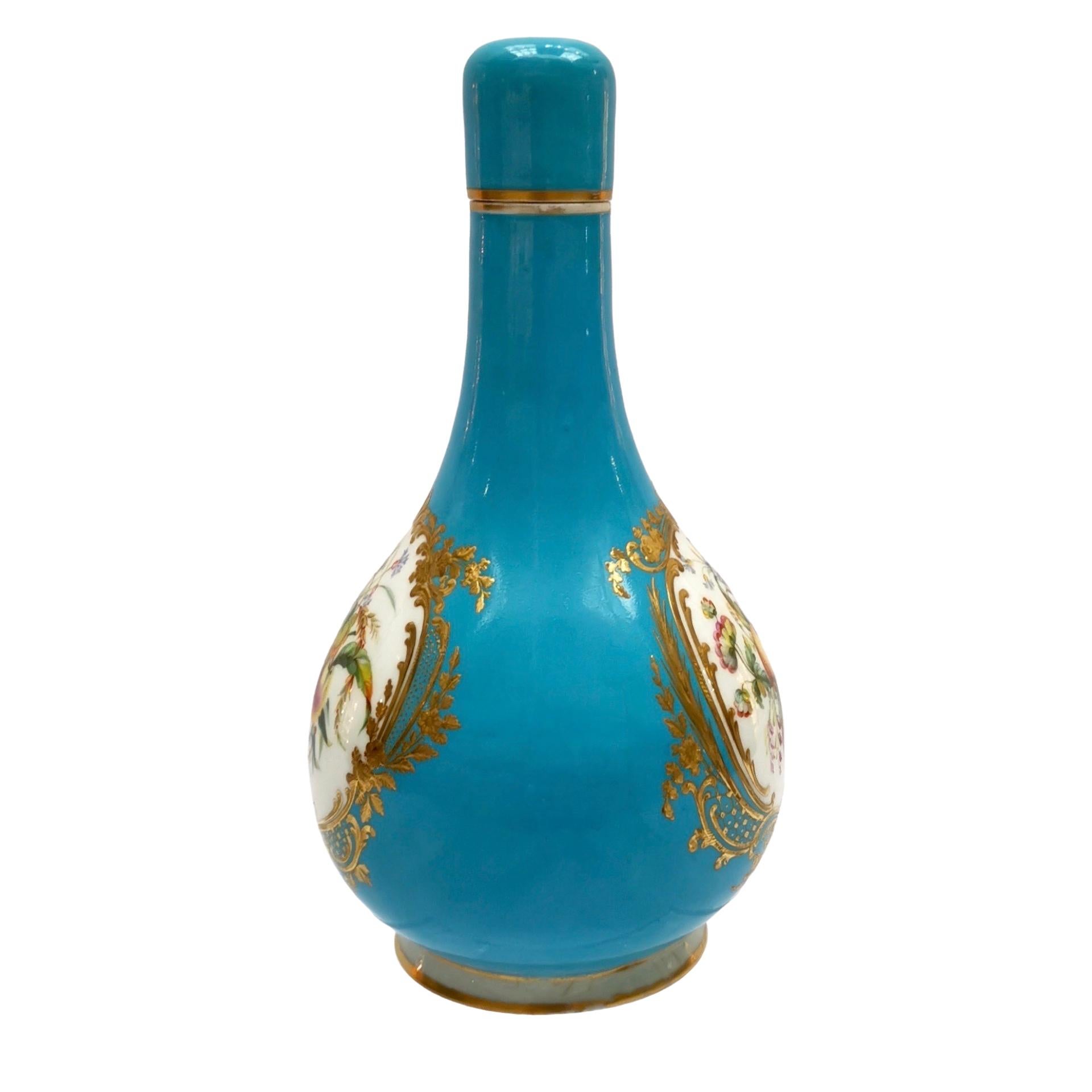 This is a beautiful little bottle vase made by Coalport between 1851 and 1861. It has stunning flower paintings by William Cook, one of the most famous painters at Coalport in the mid-19th century.

Coalport was one of the leading potters in 19th