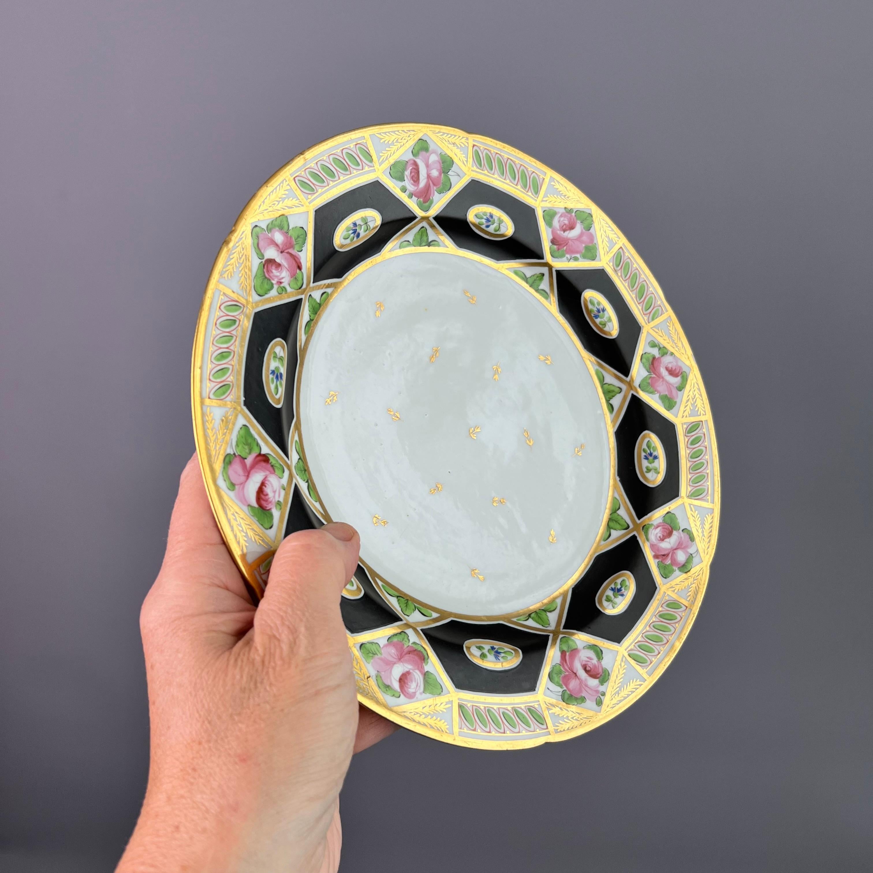 This is a beautiful dessert plate made by Coalport in about 1815. It is decorated in the famous 
