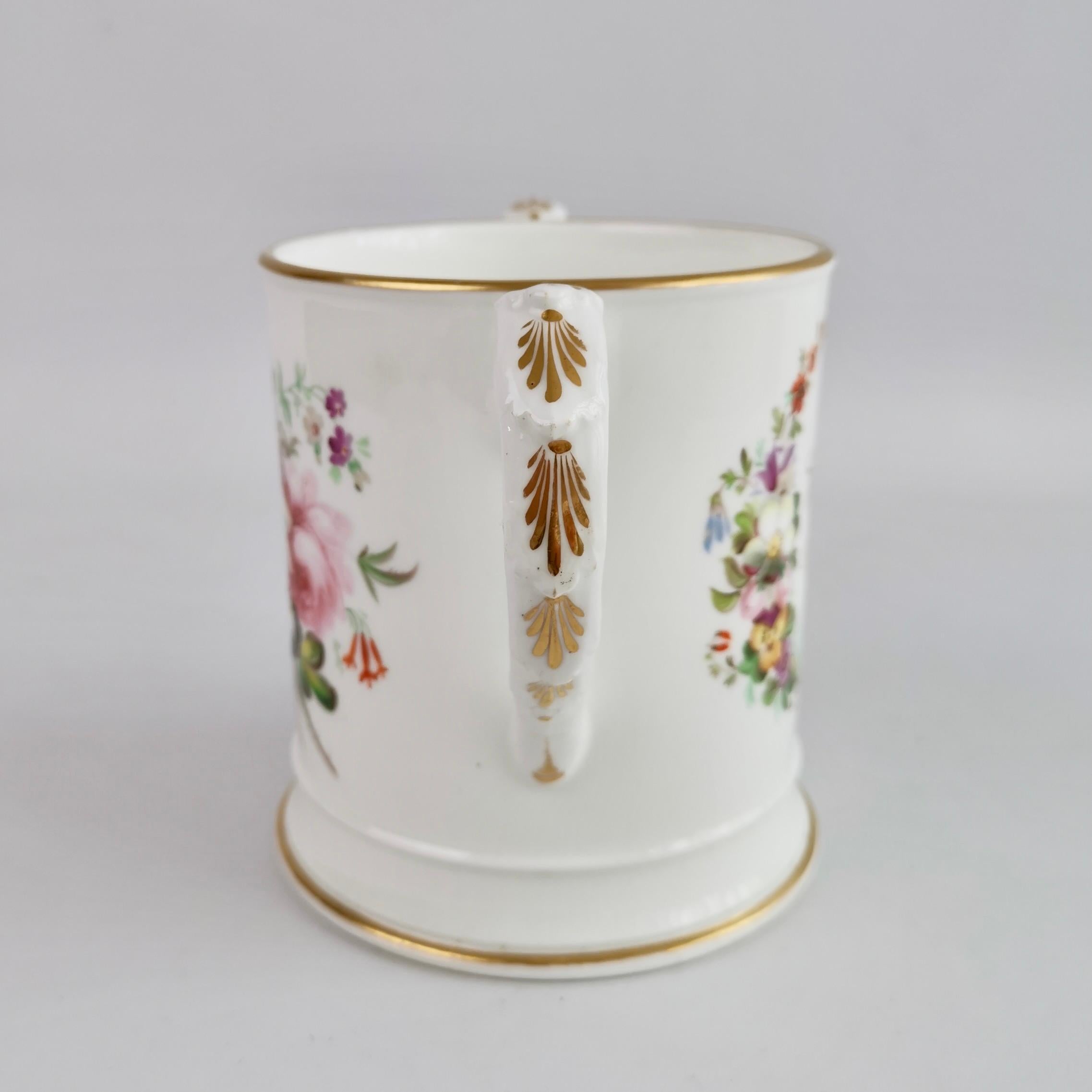 This is a huge porter mug made by Coalport in about 1845. The mug has a white ground and beautiful flowers painted by the famous painter Thomas Dixon, and in gilt font: 