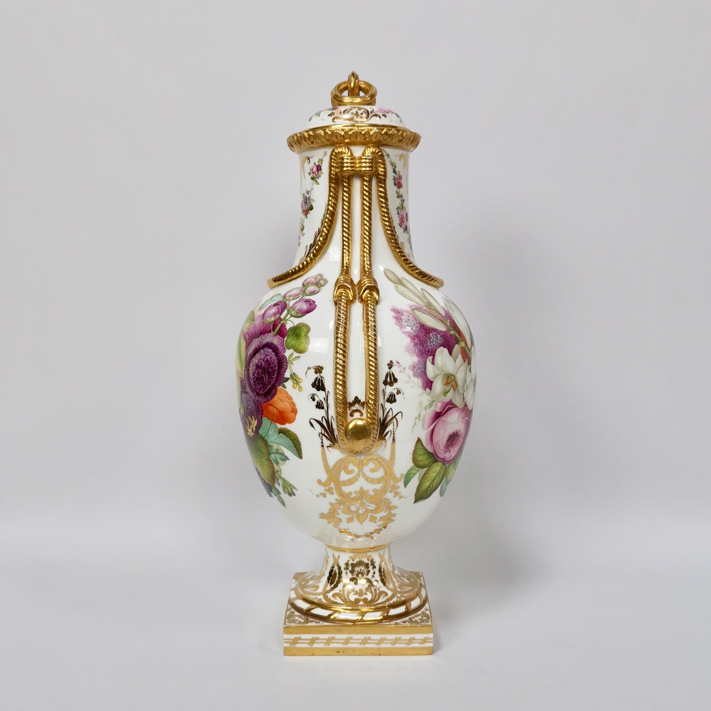 This is a stunning vase with cover made by Coalport between 1851 and 1861. The vase has beautiful gilt rope details and sublimely hand painted flowers by the famous painter William Cooke.

Coalport was one of the leading potters in 19th and 20th