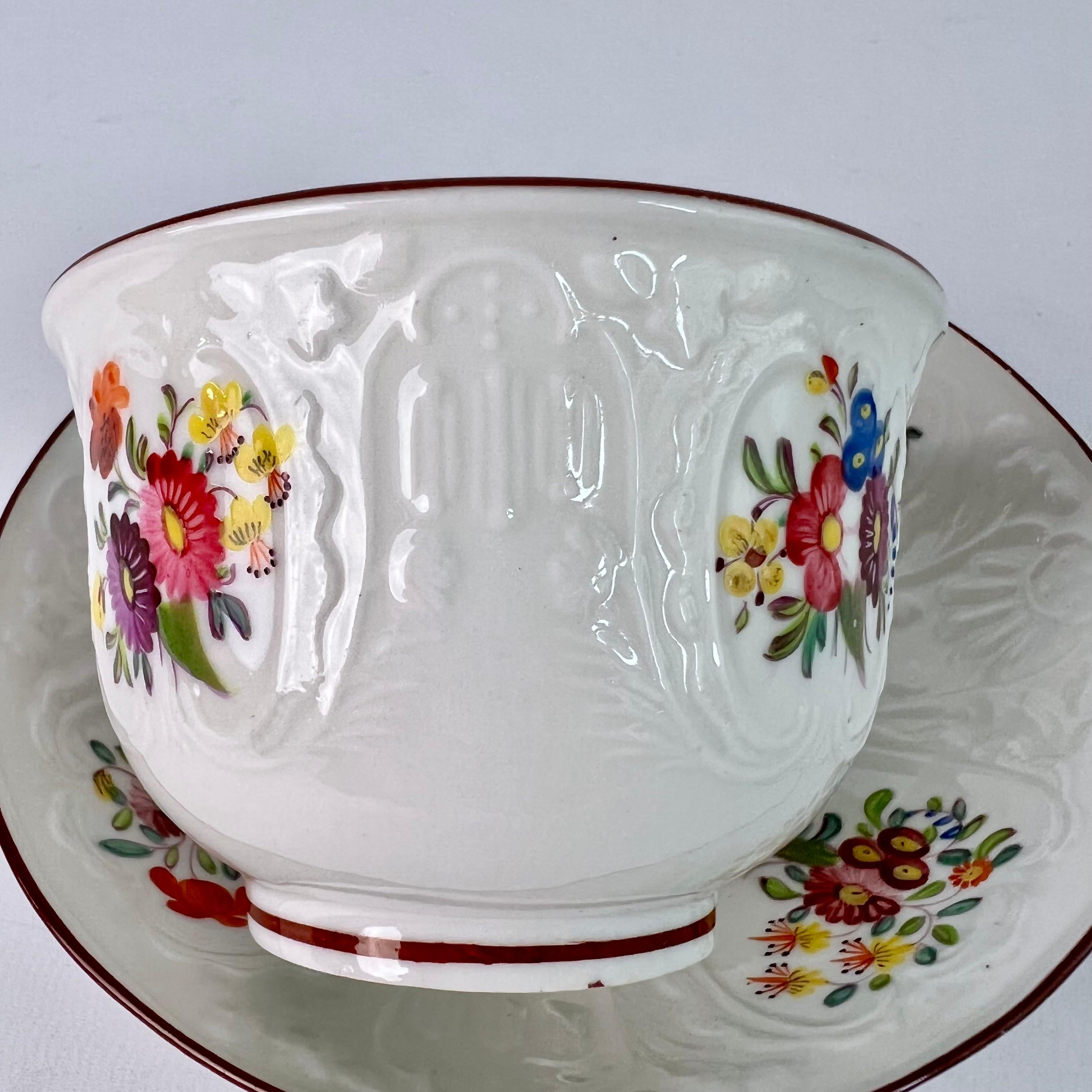 Porcelain Coalport Teacup, White Blind-Moulded Floral Dulong Pattern, ca 1817 For Sale