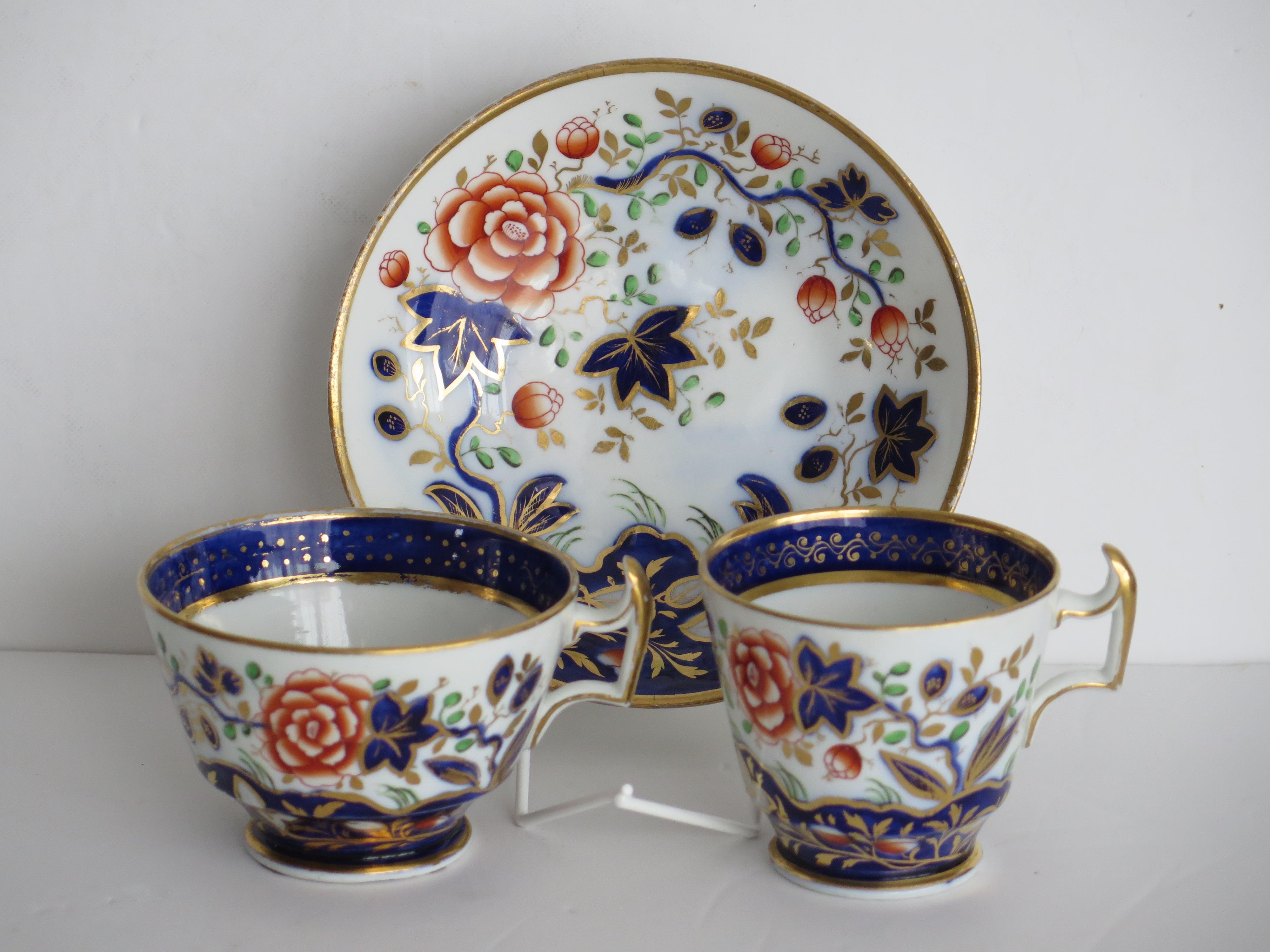 This is a very good quality TRIO of Coffee Cup, Tea Cup and Saucer that we attribute to the Coalport porcelain works, Shropshire, England, made during the George 111rd years, circa 1815.

Both cups have the London or Grecian shape with all pieces