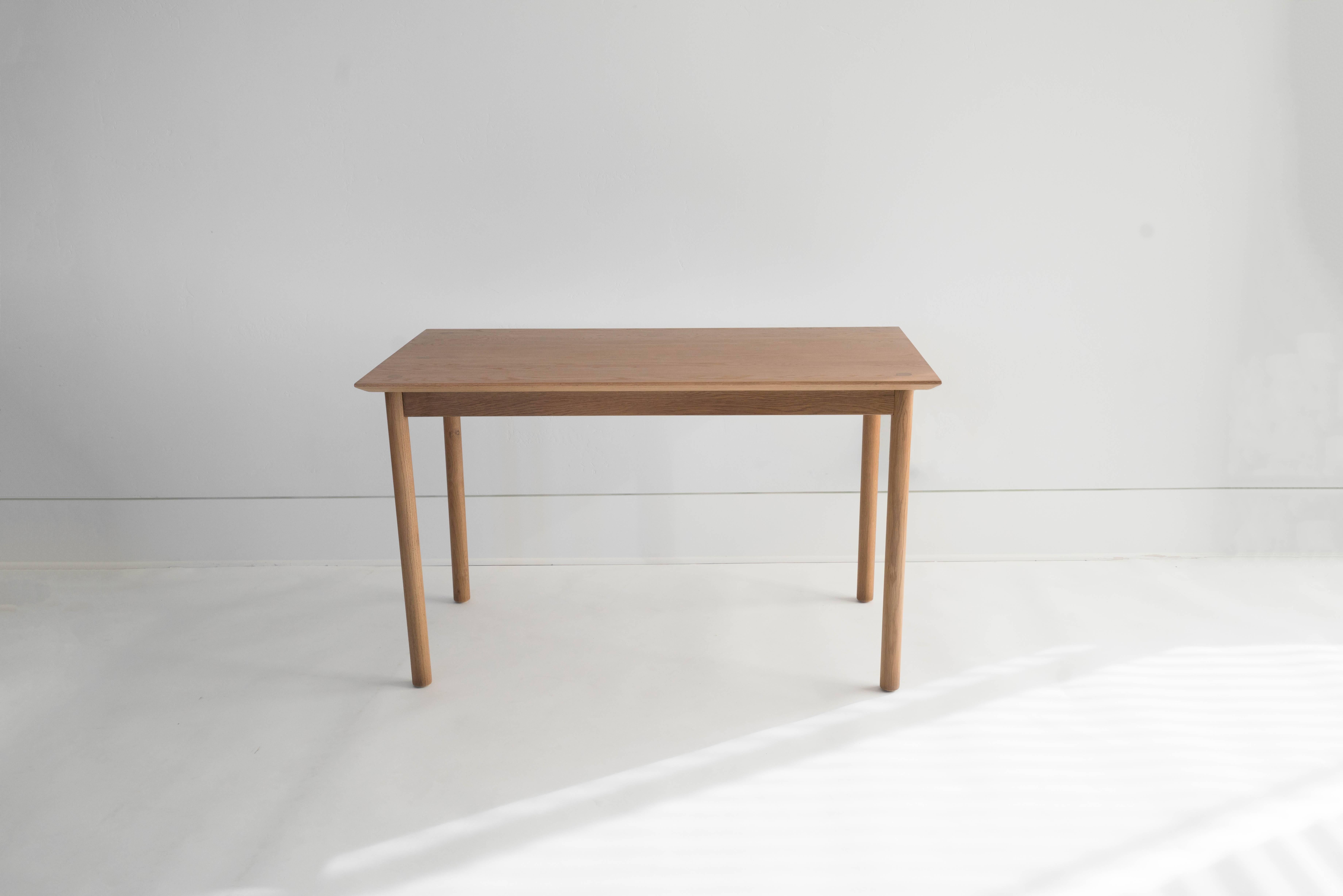 The Coast Table was designed as a quiet, humble table, with beauty in the details. We aimed to emphasize the quality and character of the wood, and let the craftsmanship speak. It's a versatile table that can be used as a desk or dining table and