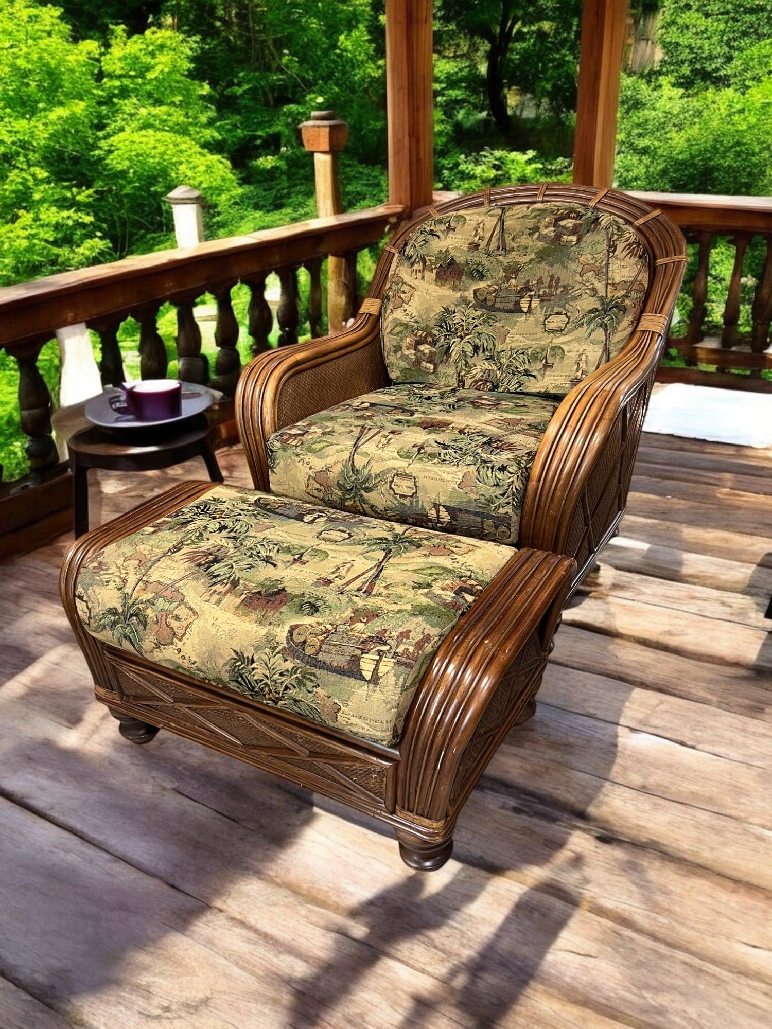 This Braxton Culler bamboo and woven reed lounge chair and ottoman set features a tropical, coastal design with a relaxed beachy vibe. Traditional elements like the arched back and rolled arms are complemented by comfortable cushions, upholstered in