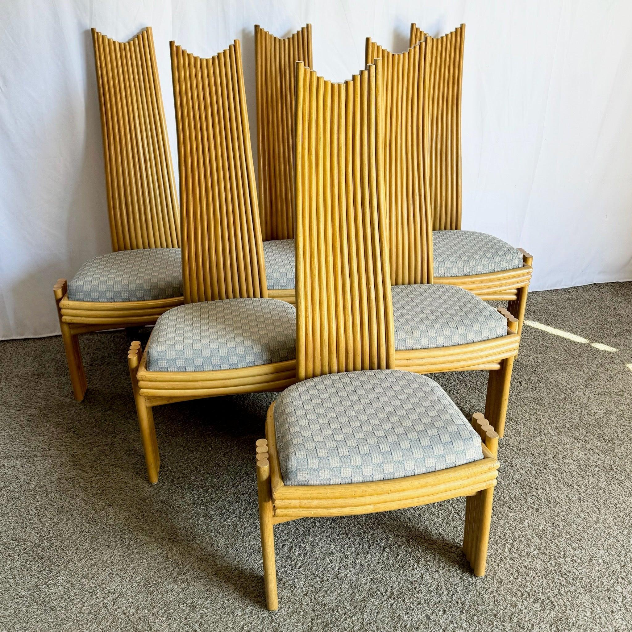 Set of six Coastal Boho rattan dining chairs with sculptural frames, natural finish, and plush cushions—ideal for tropical-inspired interiors.
 
 Minor wear around the legs as shown in the photos.