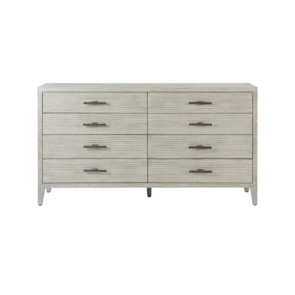 Designed to offer even more bedroom storage, the dresser is crafted from quartered pine in our sea salt finish and accented by uniquely cast ribbed bar hardware in a dark sterling finish. With eight soft close drawers atop tapered feet.

Dimensions: