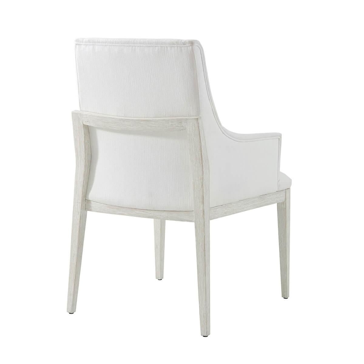 In our Sea Salt finish, the upholstered arm chair displays a comfortable upholstered seat with a fully upholstered back and arms. Raised on square tapered legs.

Dimensions: 23.5