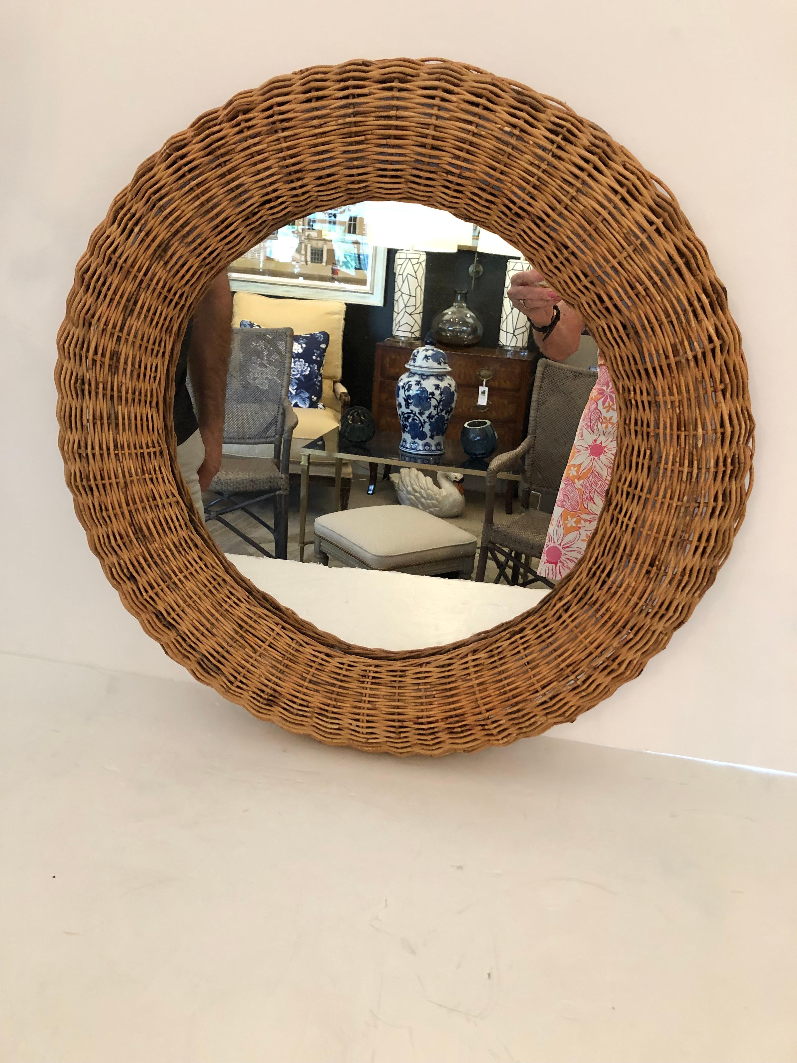Chic round wicker framed mirror adds an organic modern vibe to any room. 
 Great in a beach house!
Mirror 16 diameter.