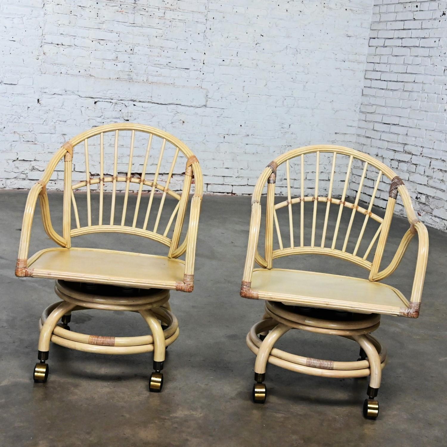 Marvelous vintage Coastal Tropical Island style cerused or whitewashed reeded rattan rolling & swivel chairs, a pair by Classic Rattan. Beautiful condition, keeping in mind that this is vintage and not new so will have signs of use and wear even if
