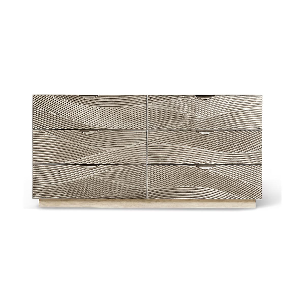 Coastal Modern Double Dresser, the cast metal texture double dresser features sculptural metal drawer fronts with a hand carved wave motif in satin white brass that shimmers against a bleached oak case.

Understated functional elements such as