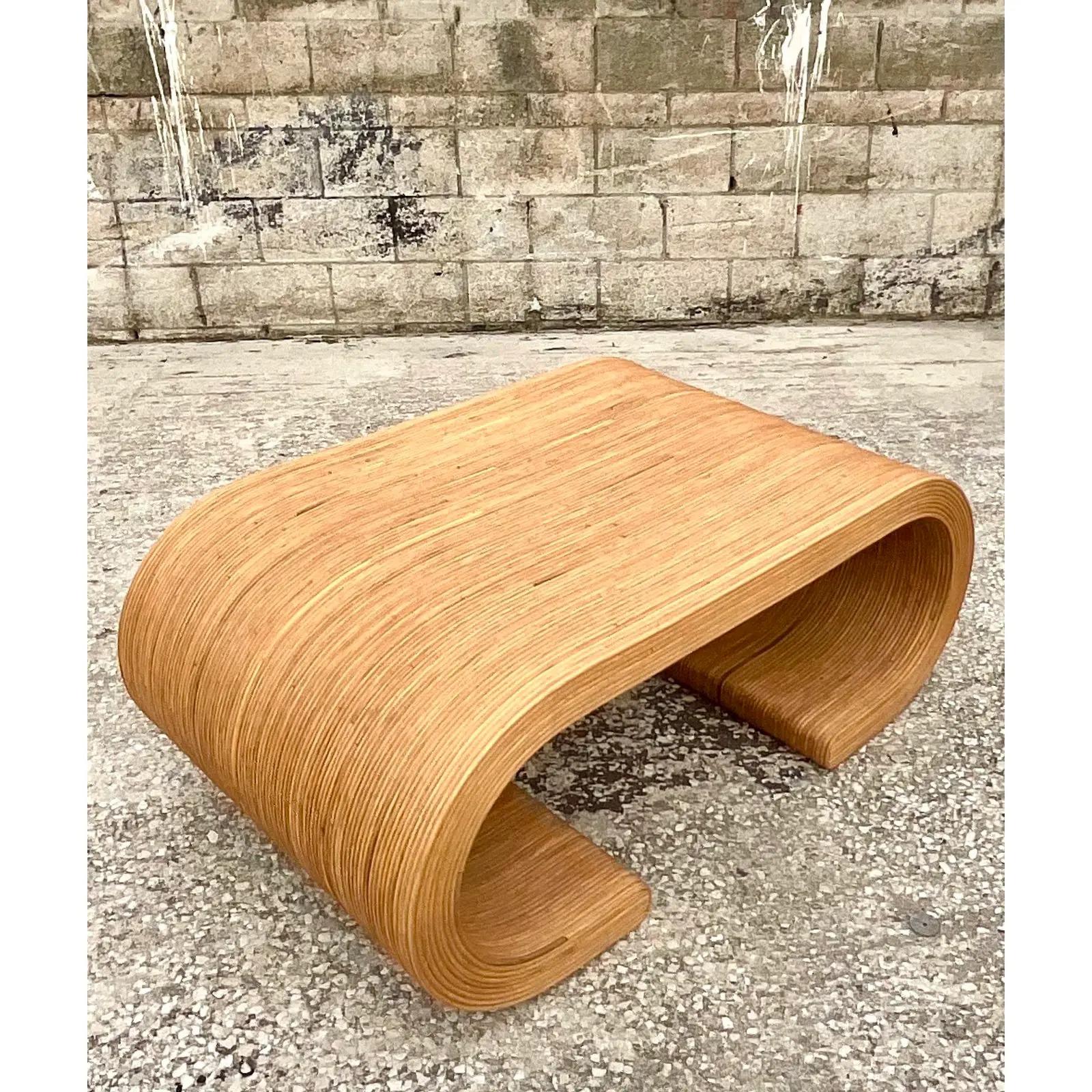 A fabulous Coastal coffee table. Beautiful pencil reed in a chic waterfall design. The perfect size. Acquired from a Palm Beach estate.