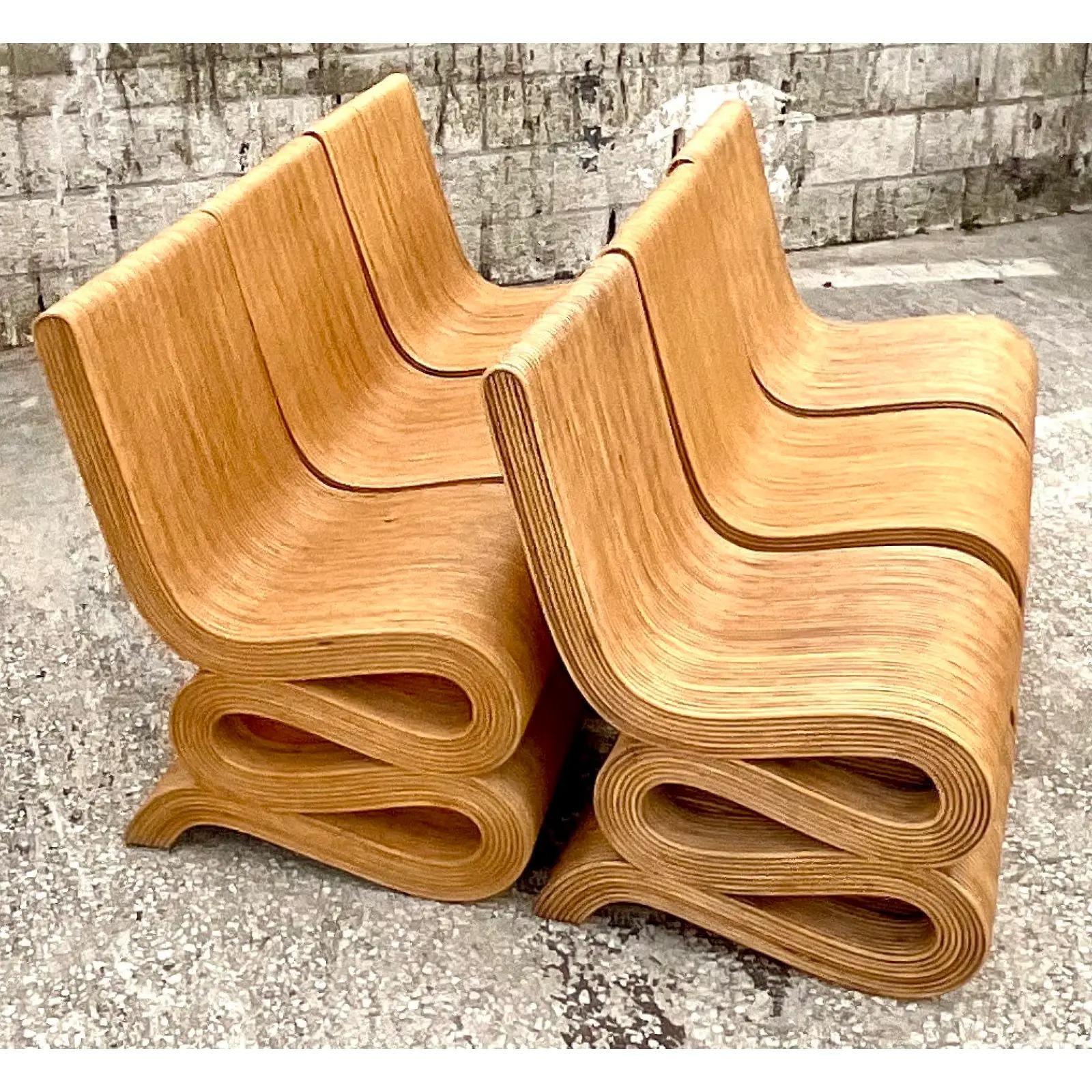 Fantastic set of Pencil Reed dining chairs. A classic Coastal homage to the iconic Gehry Wiggle chair.