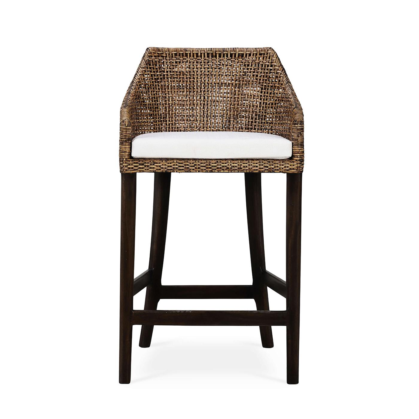 This barstool features a sturdy wooden frame finished in a rich, dark walnut stain, providing both durability and a timeless appeal. The backrest and sides are crafted from beautifully woven rattan in a warm glaze finish, adding a touch of rustic