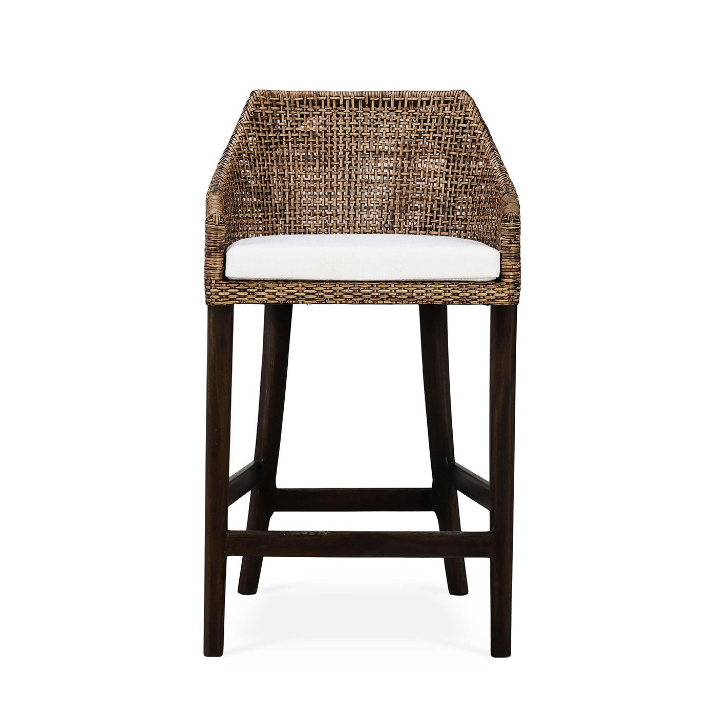 This stool features a sturdy wooden frame finished in a rich, dark walnut stain, providing both durability and a timeless appeal. The backrest and sides are crafted from beautifully woven rattan in a warm glaze finish, adding a touch of rustic charm