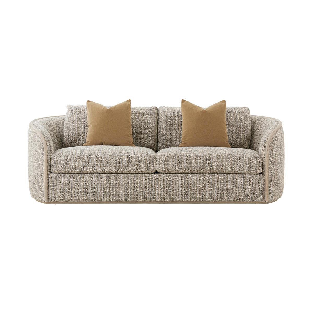 A refined and versatile seating option that seamlessly combines the natural beauty of wood with the cozy texture of chenille.

Crafted with a light Oak finish frame for a sleek and sophisticated look, this sofa is upholstered in an elegant textured