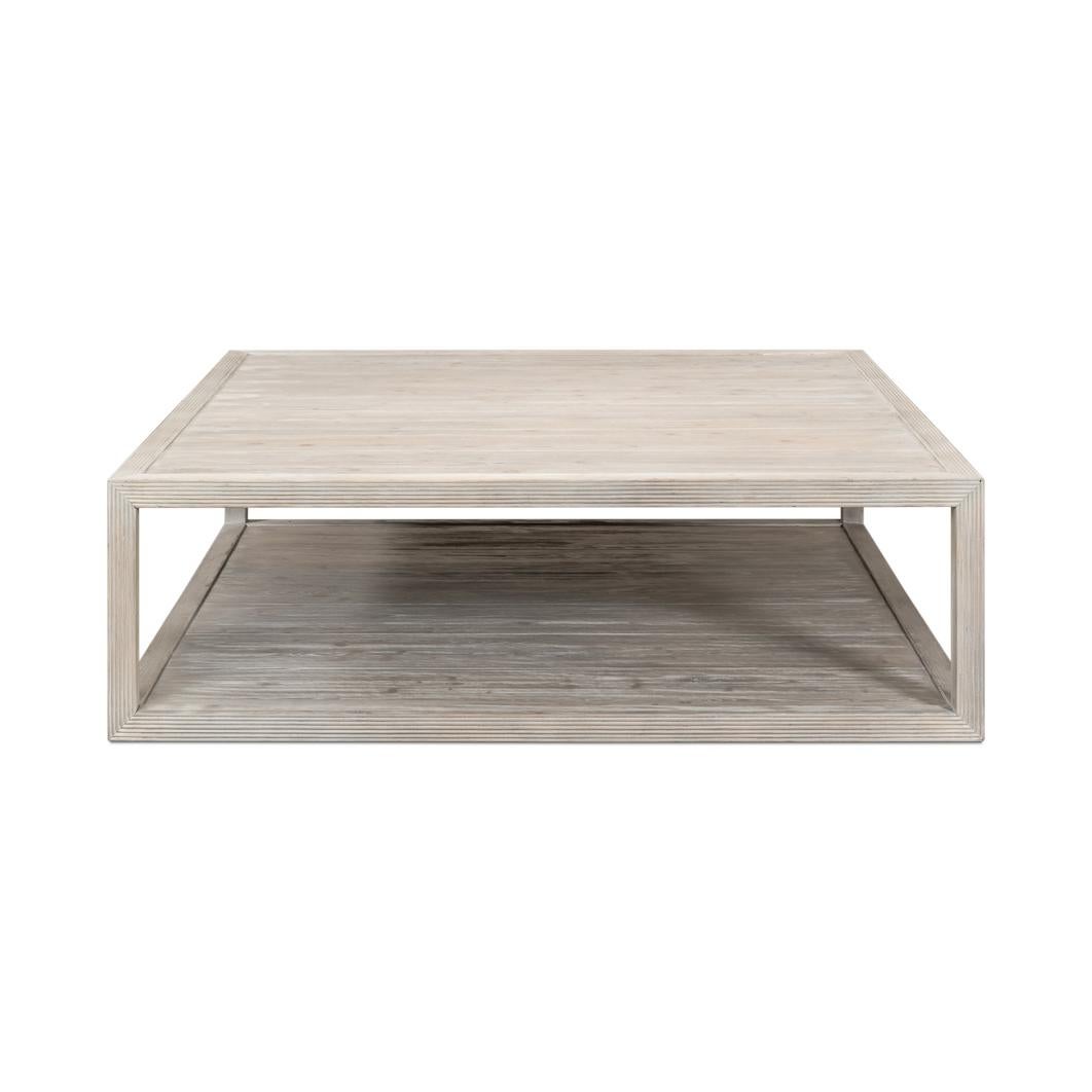 Coffee table brings refined simplicity and relaxed sophistication to any living space. Crafted in pine and finished in a soft Grey Thorne, this table showcases a clean-lined, open-frame design that emphasizes symmetry and balance. The weathered