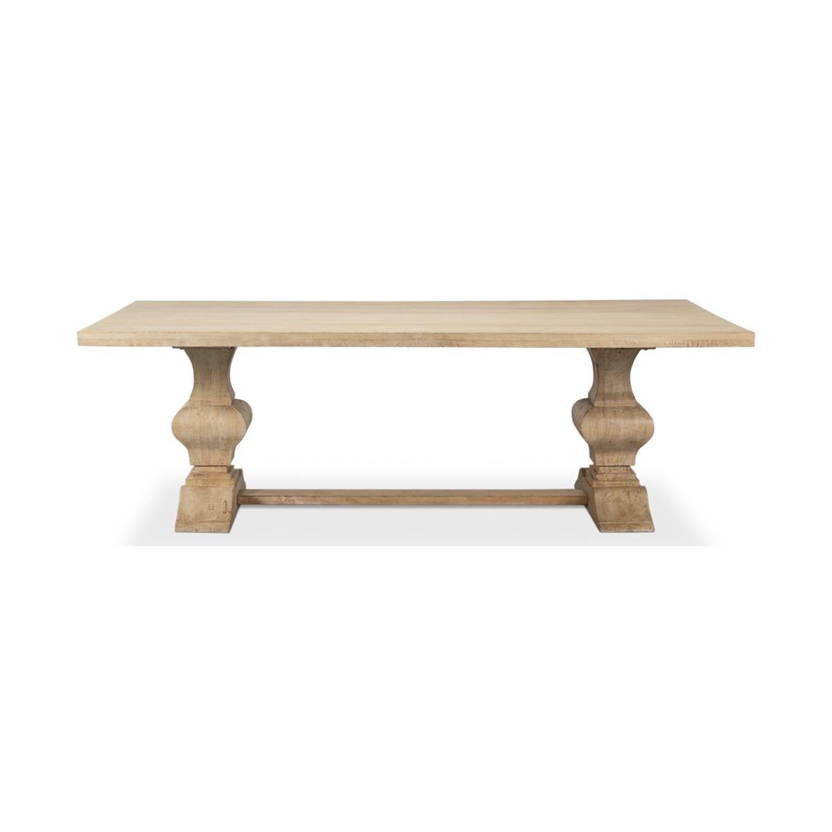 Coastal style refectory dining table, rich mango wood in a natural coastal style sienna finish, the rectangular old world style refectory dining table is raised on bold trestle and columns with a stretcher base.

Dimensions: 94