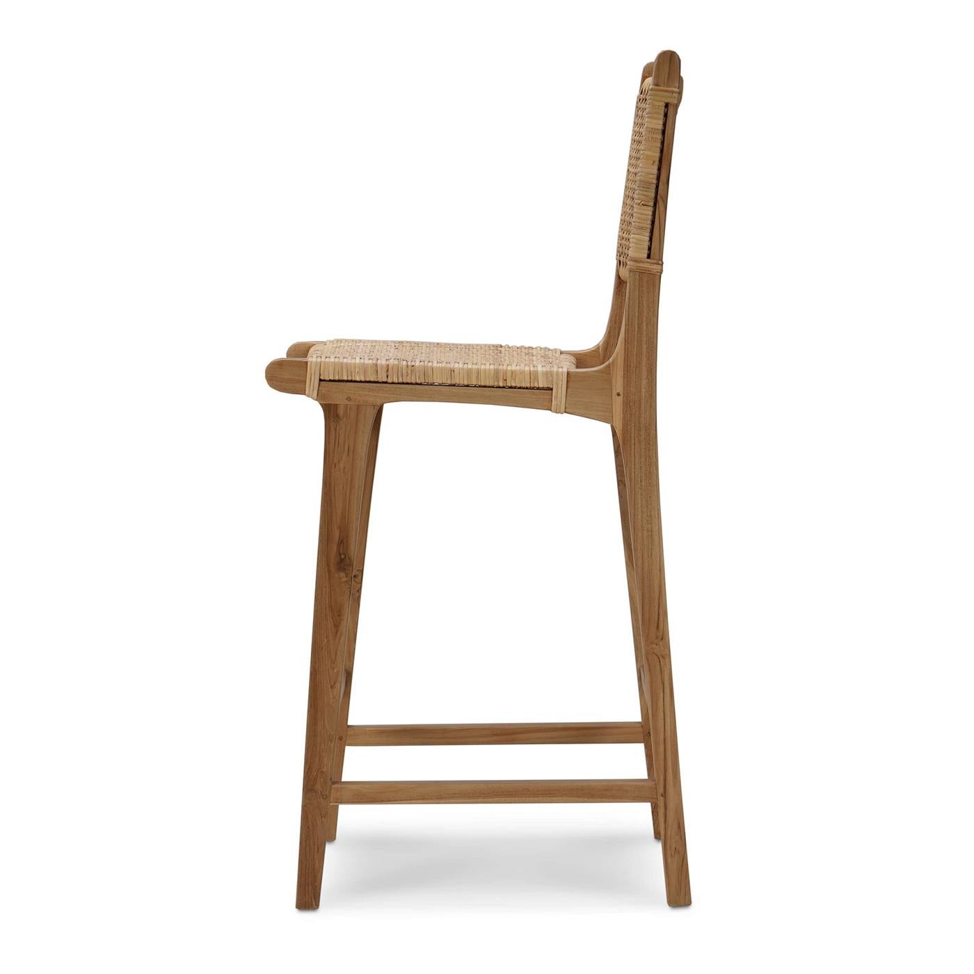 A harmonious blend of coastal charm and modern elegance. This barstool features a sturdy teak wood frame with a natural finish, ensuring durability and timeless style. The seat and backrest are crafted from beautifully woven natural rattan,