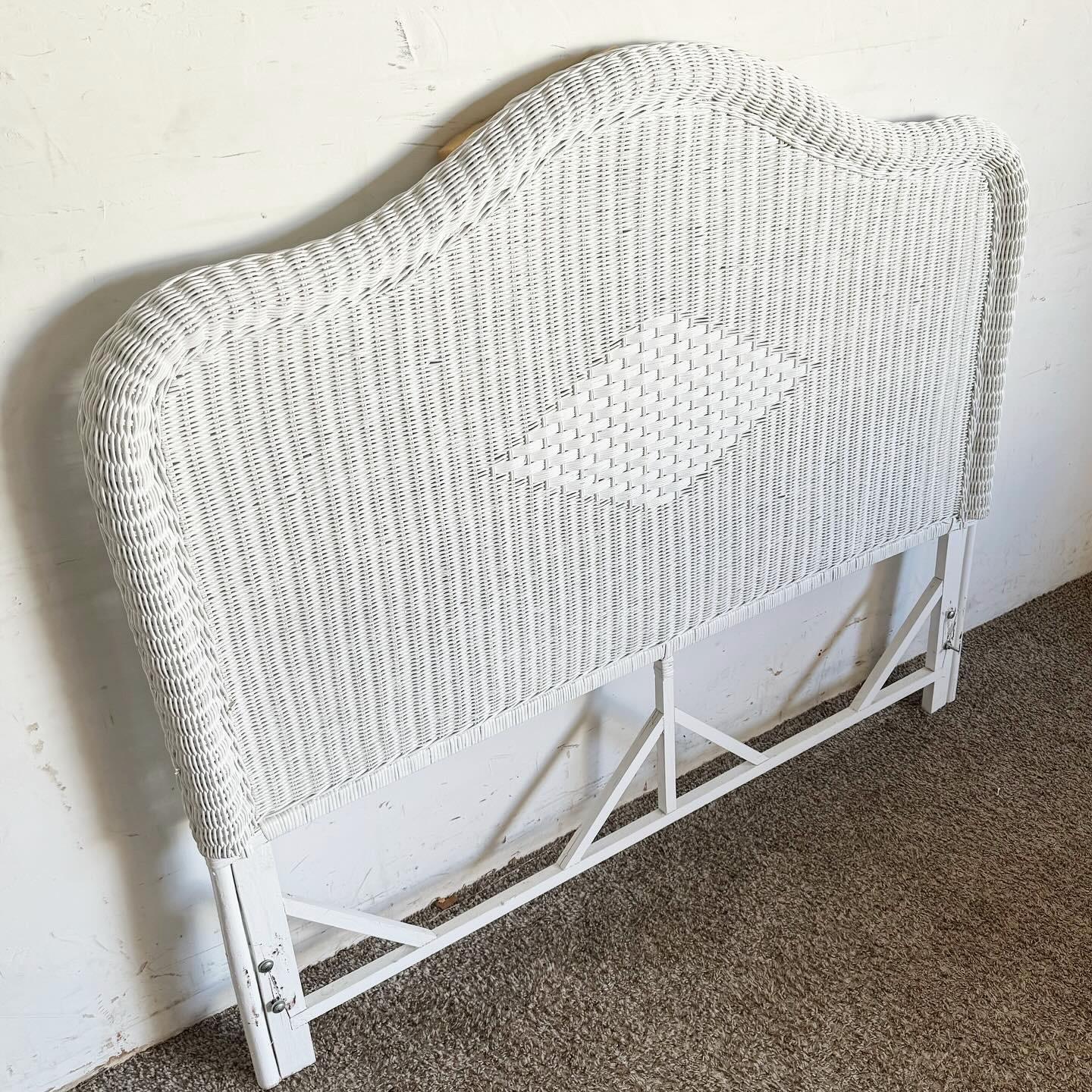 Step into a serene coastal paradise with this Coastal White Wicker Full Size Headboard. Crafted with durable wicker and finished in a fresh white, it radiates a light, airy vibe perfect for a tranquil retreat. The headboard's intricate weave pattern