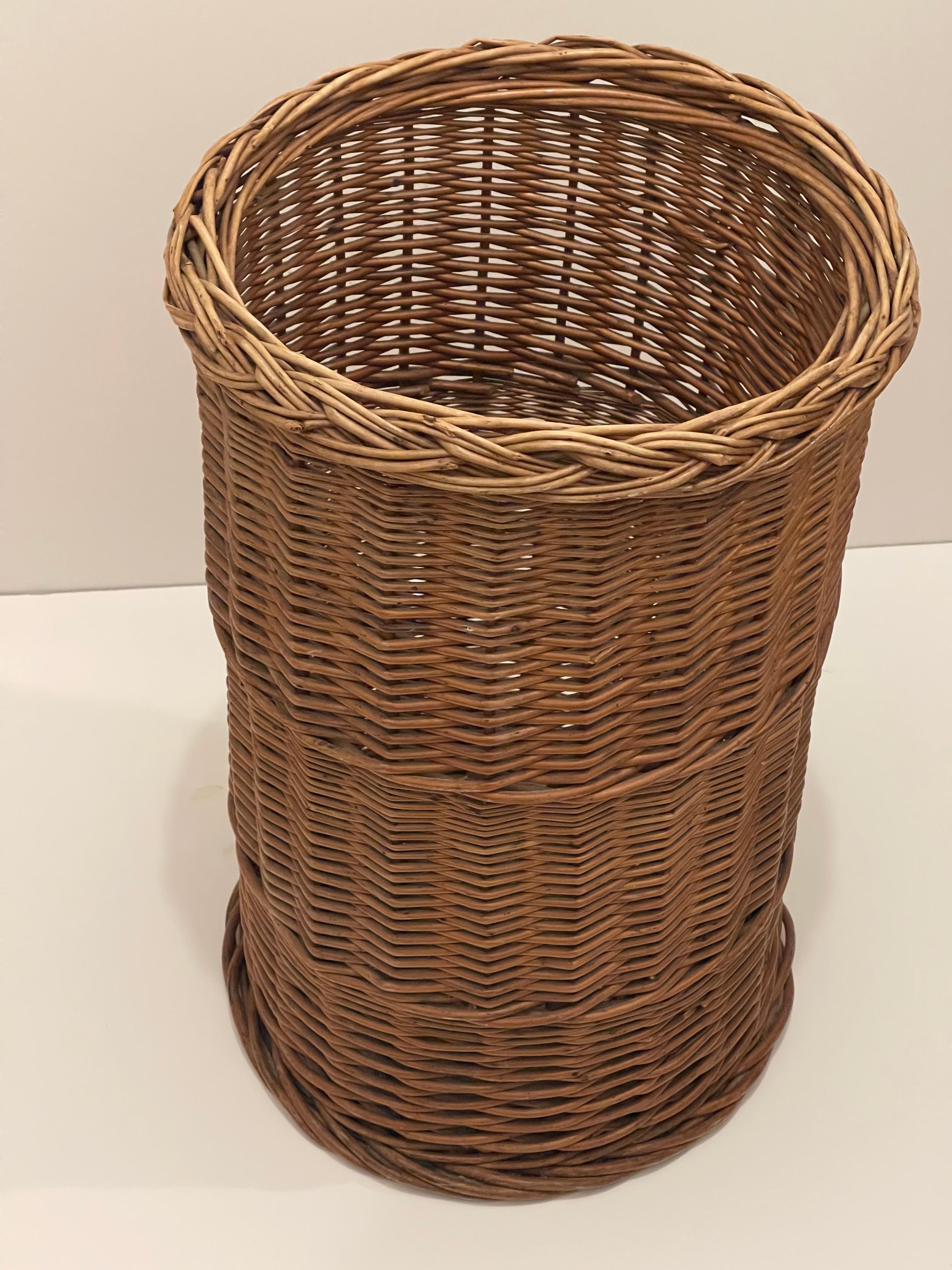 Vintage handwoven rattan umbrella stand.