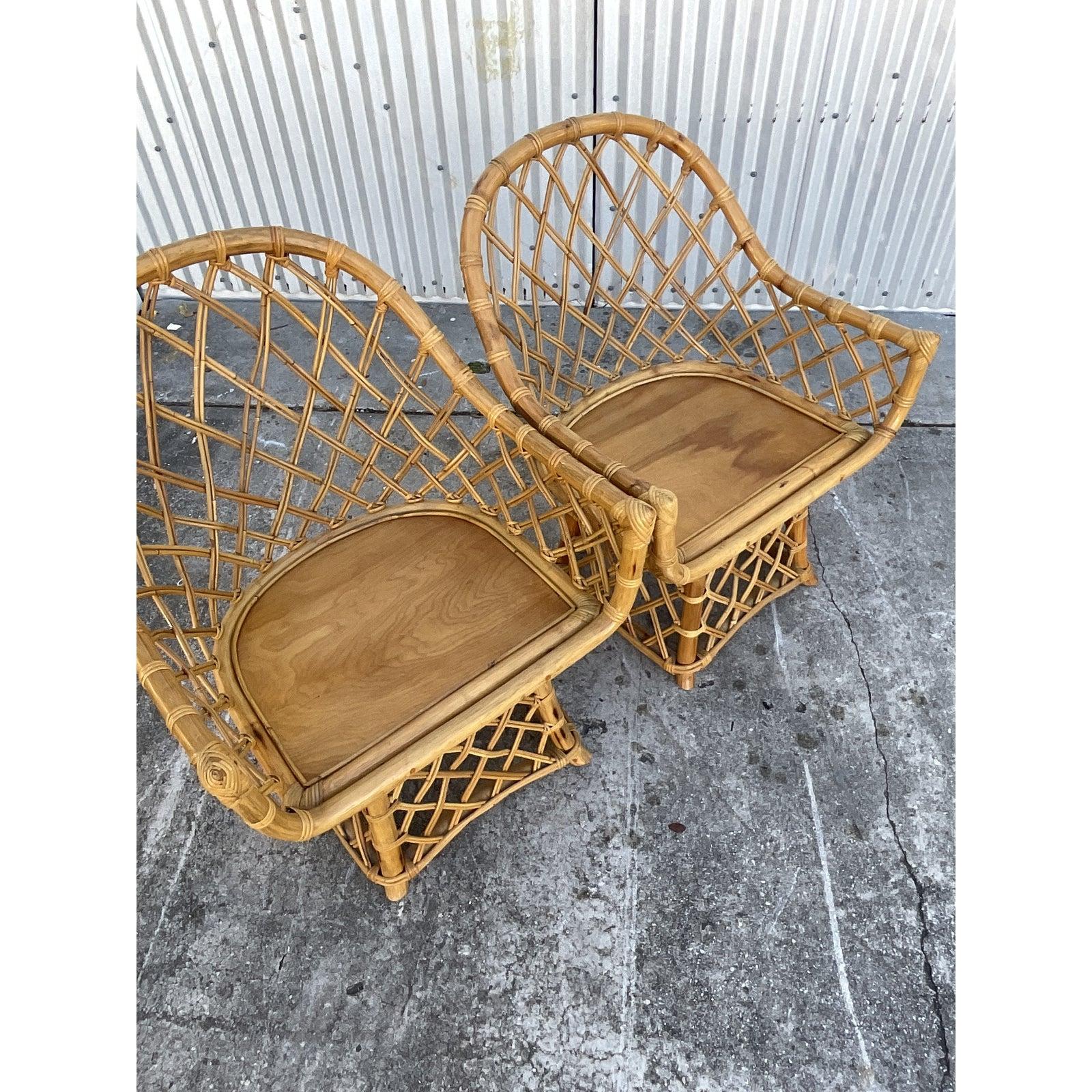 20th Century Coastal Willow and Reed Fretwook Rattan Swivel Chairs, a Pair
