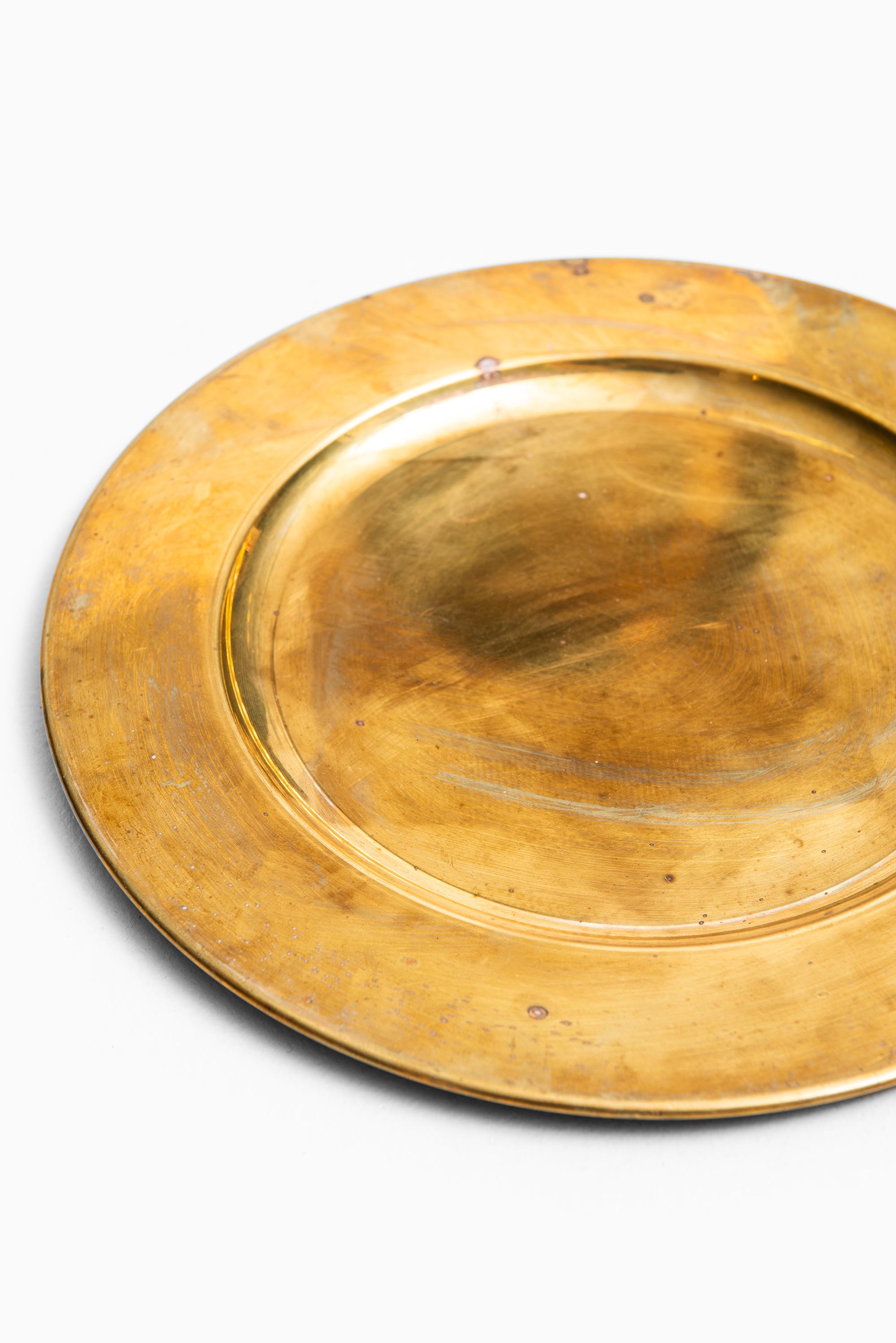 Coaster plates in brass. Produced by Stelton in Denmark.