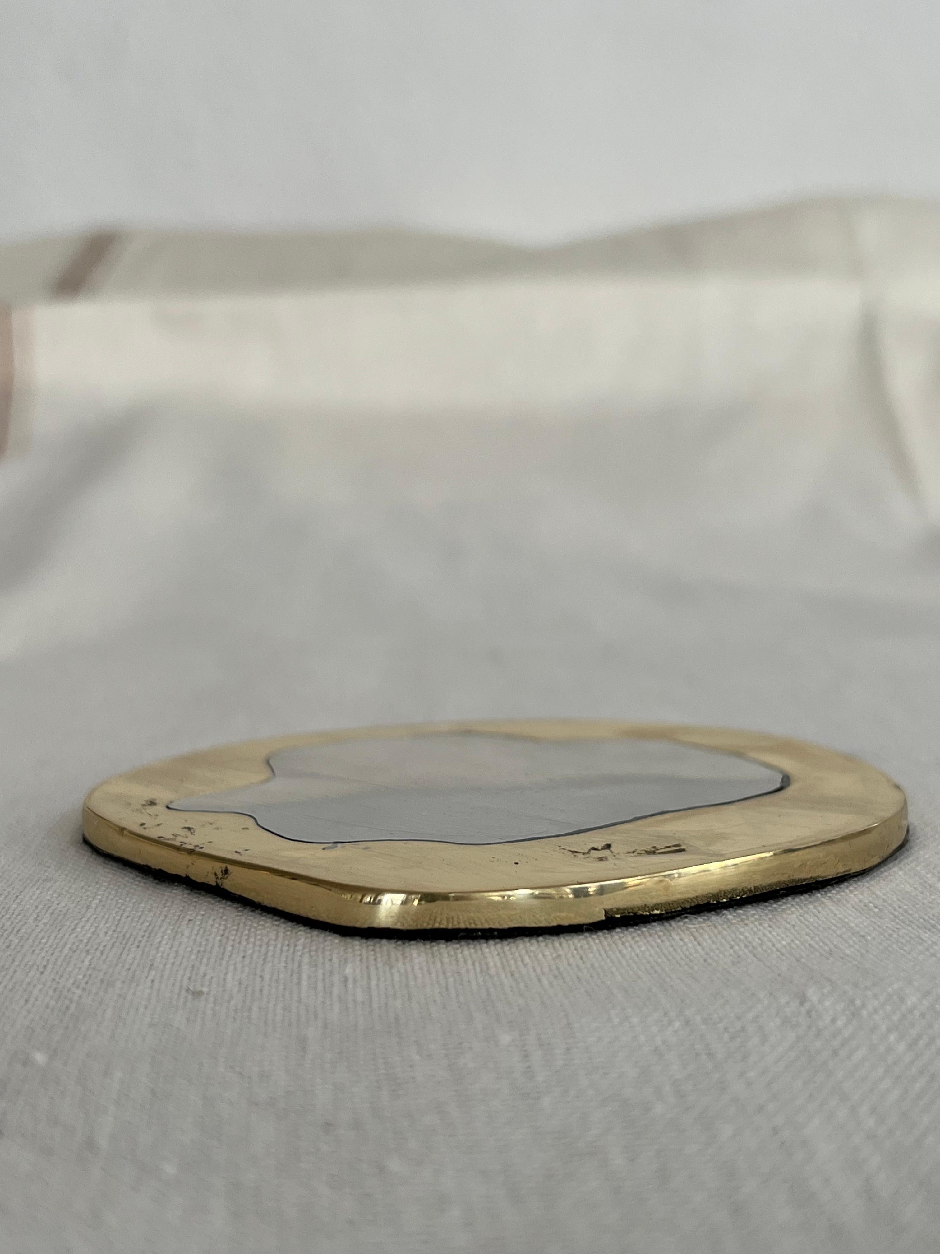 The decorative Coaster was created by David Marshall, it is made of sand cast aluminum and sand cast brass. We can engrave this piece with your Initials or Logo, makes a beautiful Wedding or Company Gift.
Handmade, mounted and finished in our