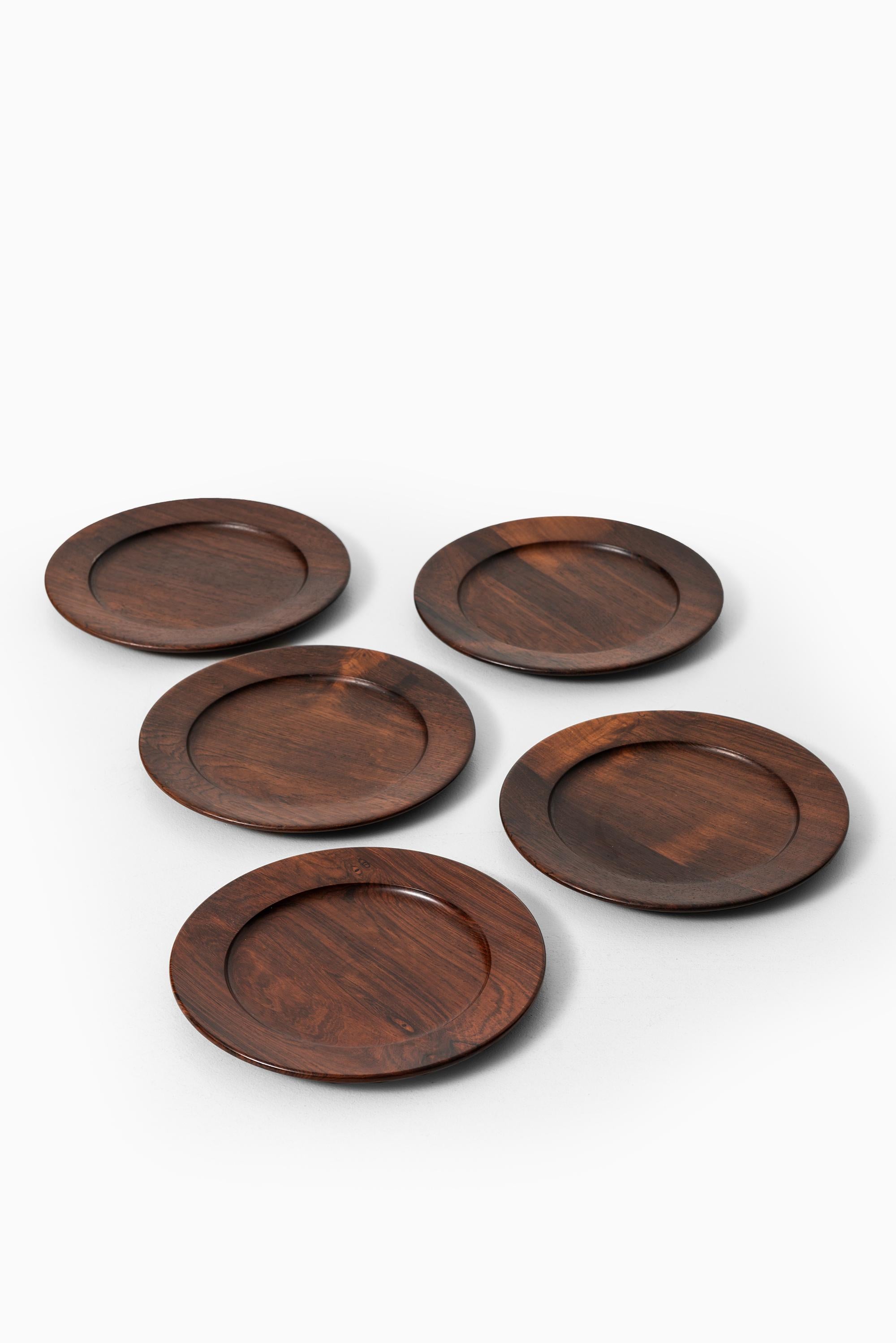 Set of 13 coaster plates attributed to Jens Quistgaard. Produced in Denmark.