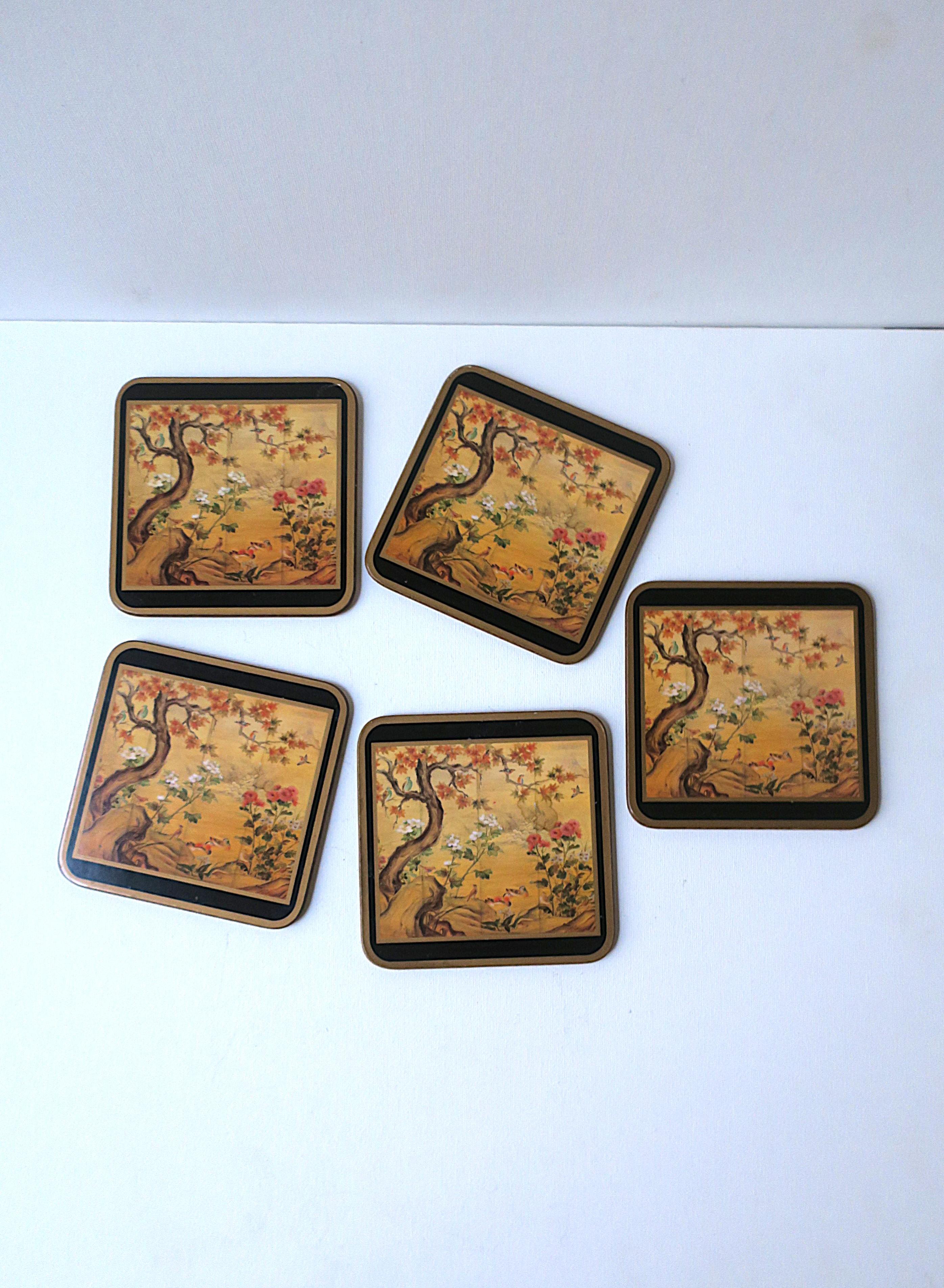 An English set of five (5) drinks coasters with Chinoiserie design finished with a black and gold edge, England, circa late-20th century. Scene depicts birds, trees and flowers surrounded by a black and gold edge. A great addition to any bar, bar
