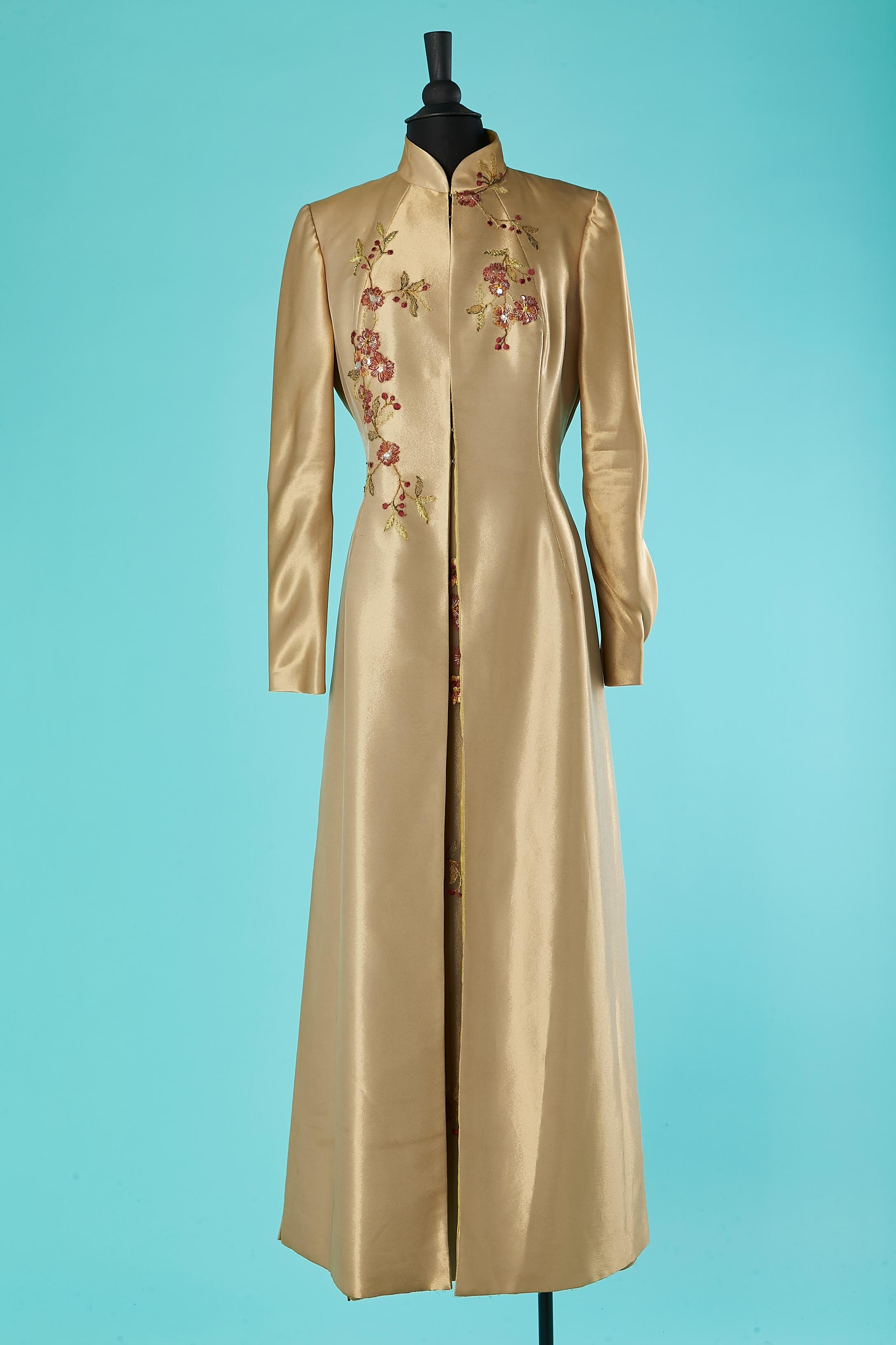 coat and dress ensemble with embroideries. 
Main fabric composition: 59% polyester, 20% silk, 21% rayon. Satin lining. Dress closure: zip in the middle back. Coat closure : hook&eye in the middle front. 
Split on the front side of the dress= 48