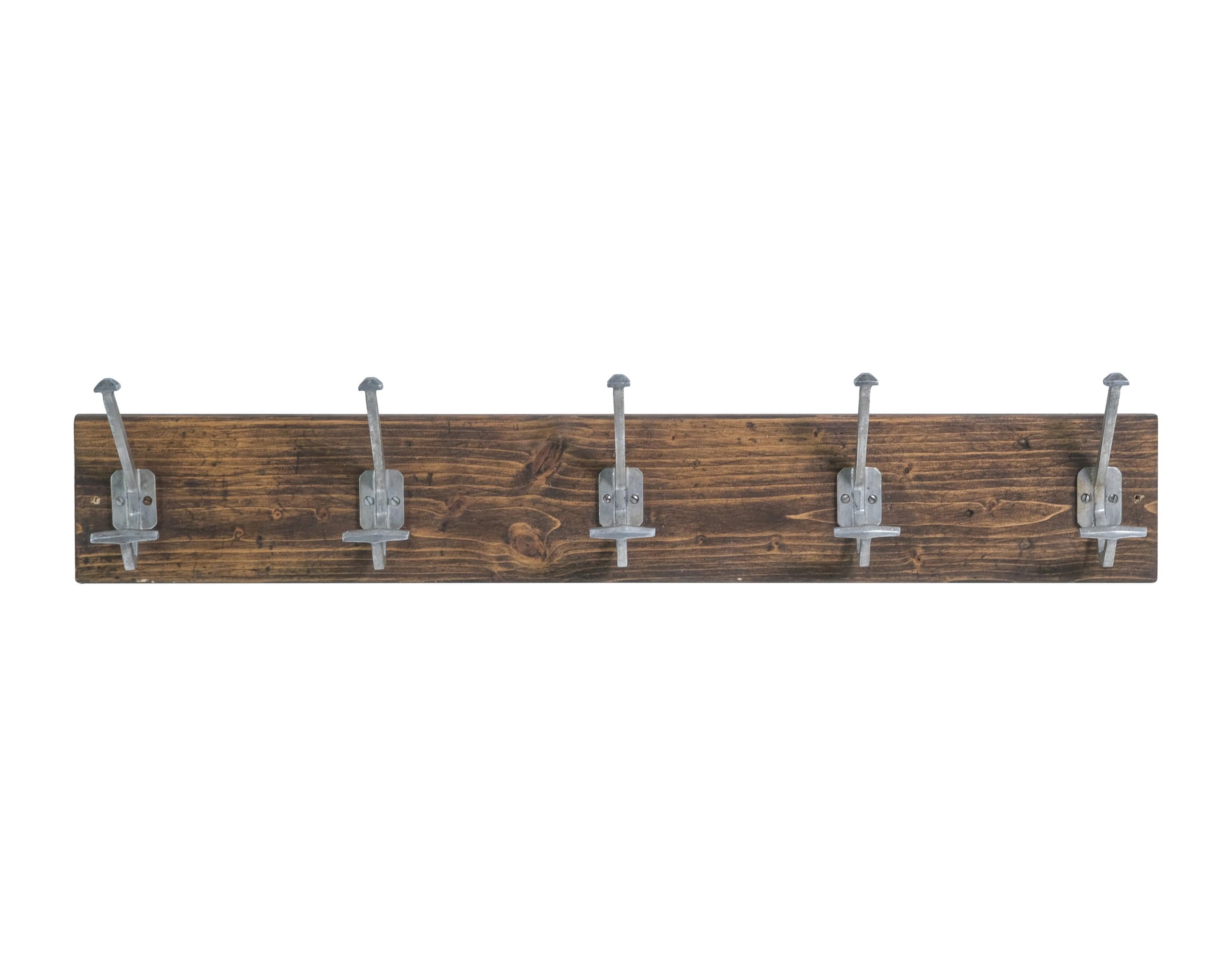 Coat and hat rack from Europe. This features five aluminum double hook hooks mounted to a piece of pine. Please note, this item is located in our Scranton, PA location.