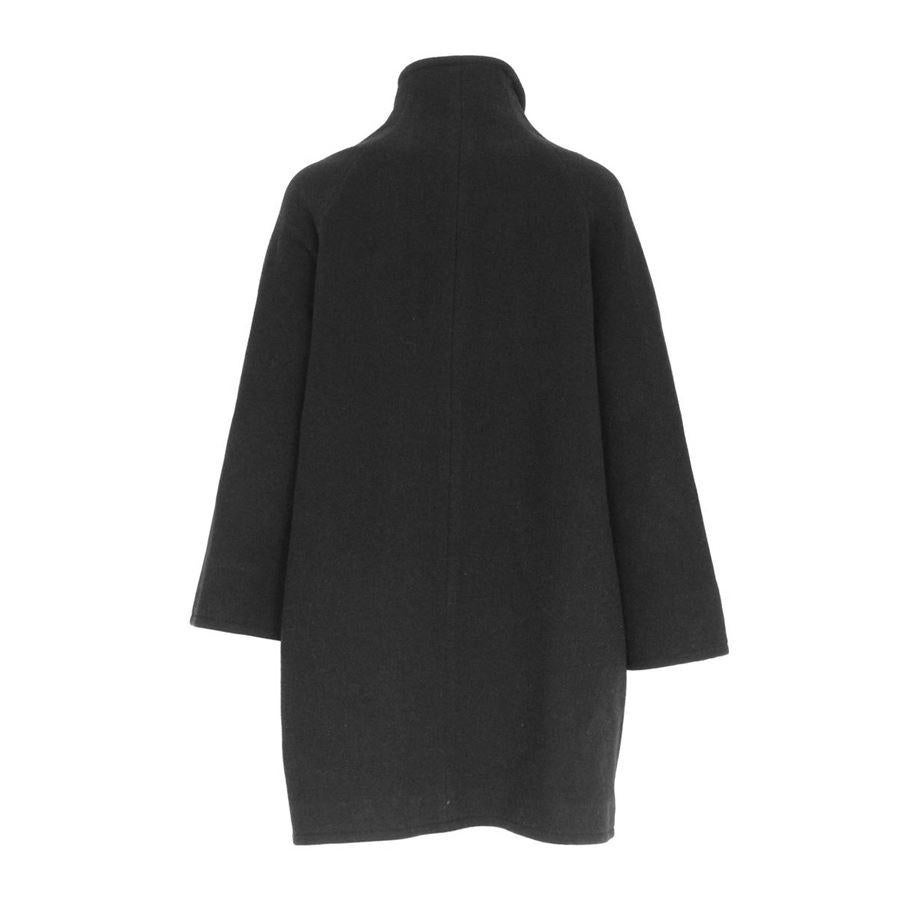 Wool (77%) Black color Zip closure Two pockets Length from shoulder cm 80 (31.4 inches) Shoulders length cm 42 (16.5 inches)
