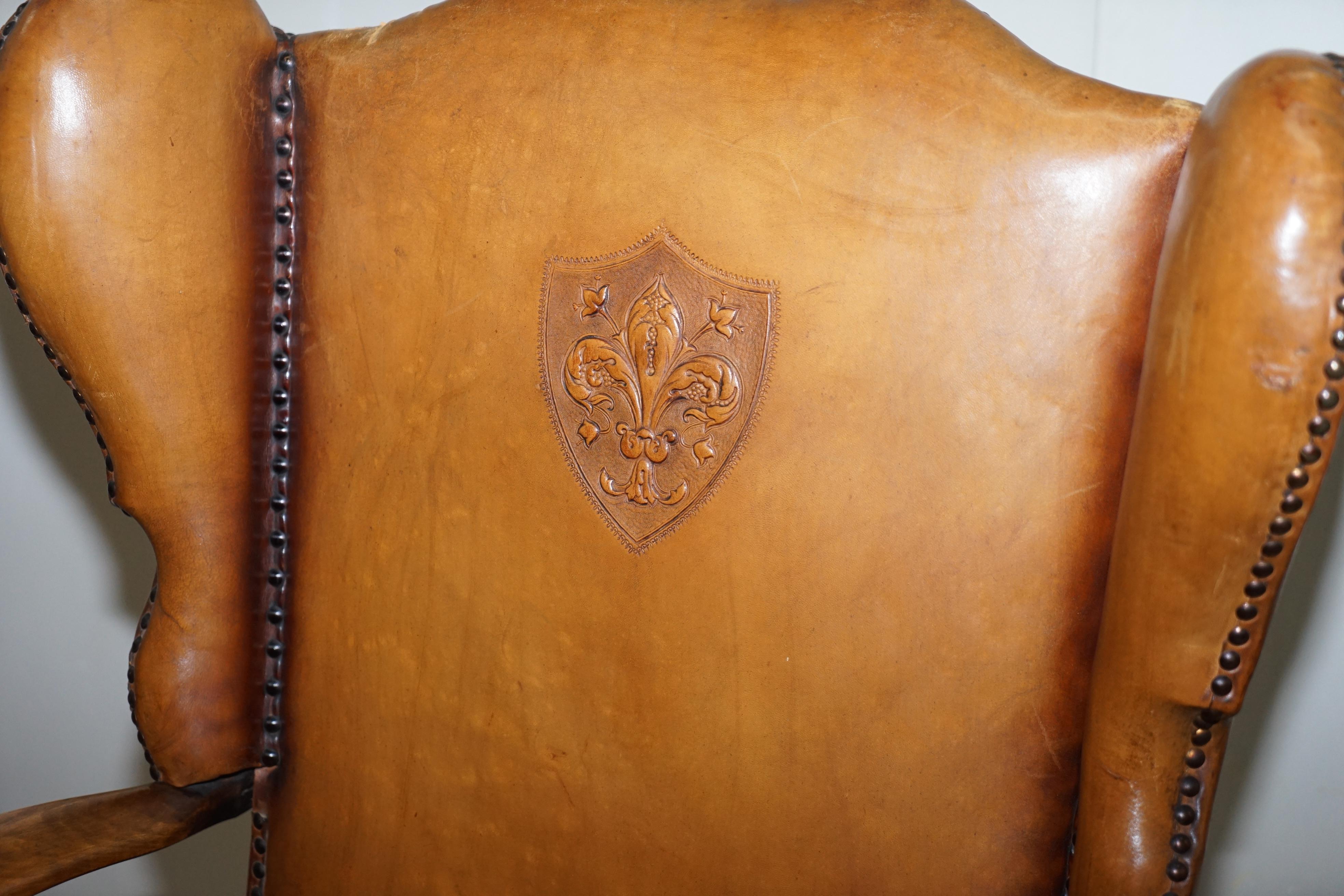 British Coat of Arms Armorial Crest Edwardian Oak and Brown Leather Wingback Armchairs