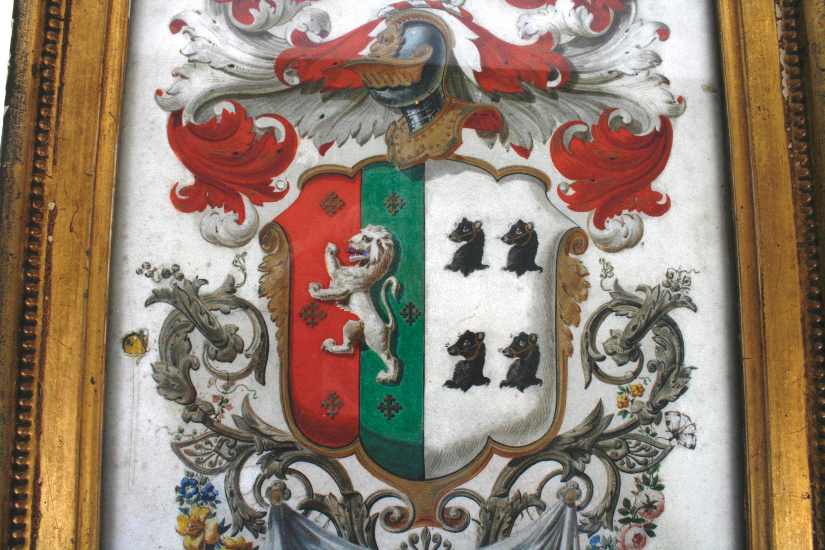 The Scottish coat of arms belonging to George Hutchinson reverse painted on glass. The painting is framed in an antique giltwood frame with a hand written note, in two hands, on the reverse protected by Lucite. The note includes 