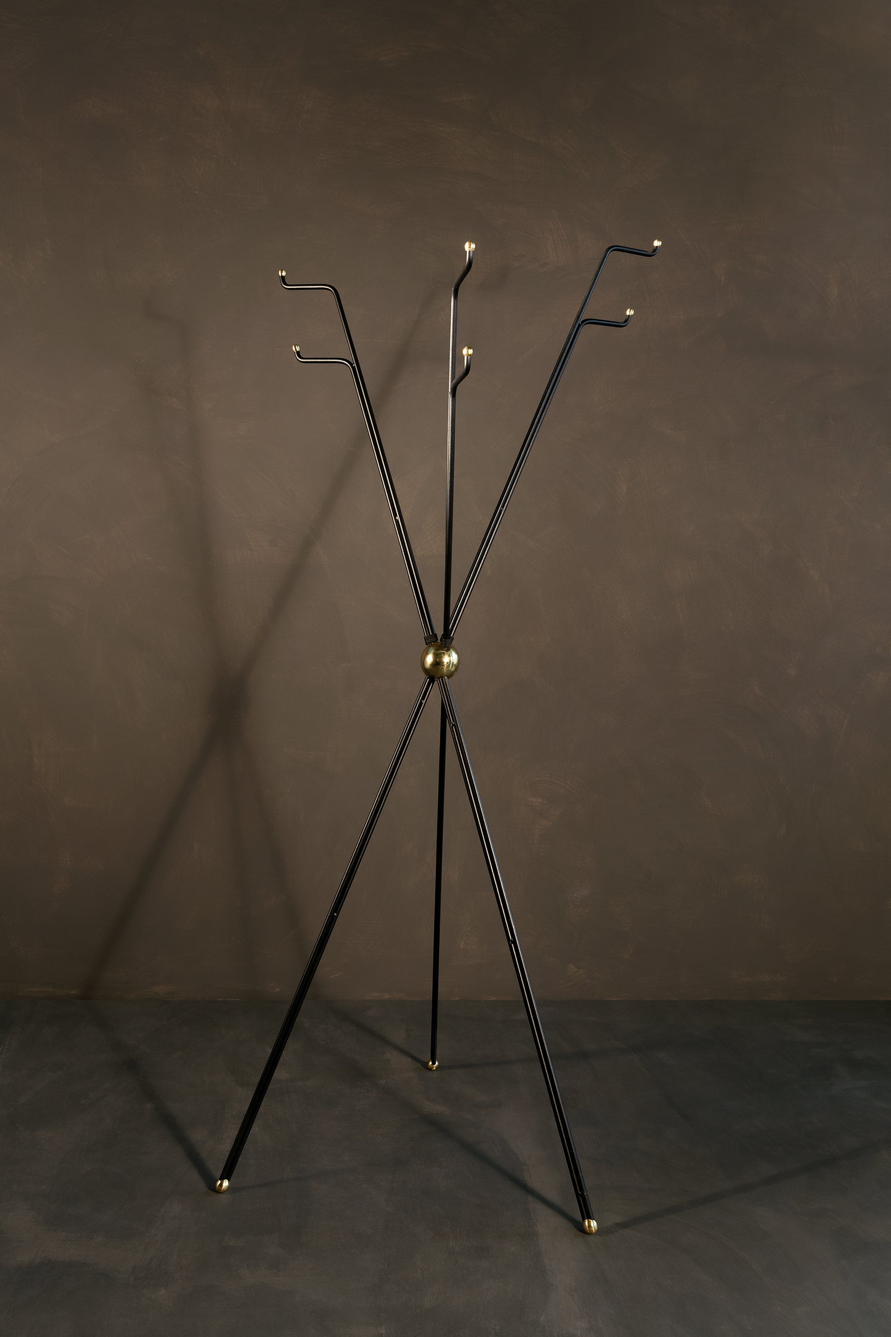 Coat Rack by Estudio Andean
Dimensions: D 63 x H 170 cm
Materials: steel, bronze.

Coat rack of 3 different heights, made of steel rods with a central sphere of sand-cast bronze and lathed bronze hardware.

ALEJANDRO MOYANO
FOUNDER &