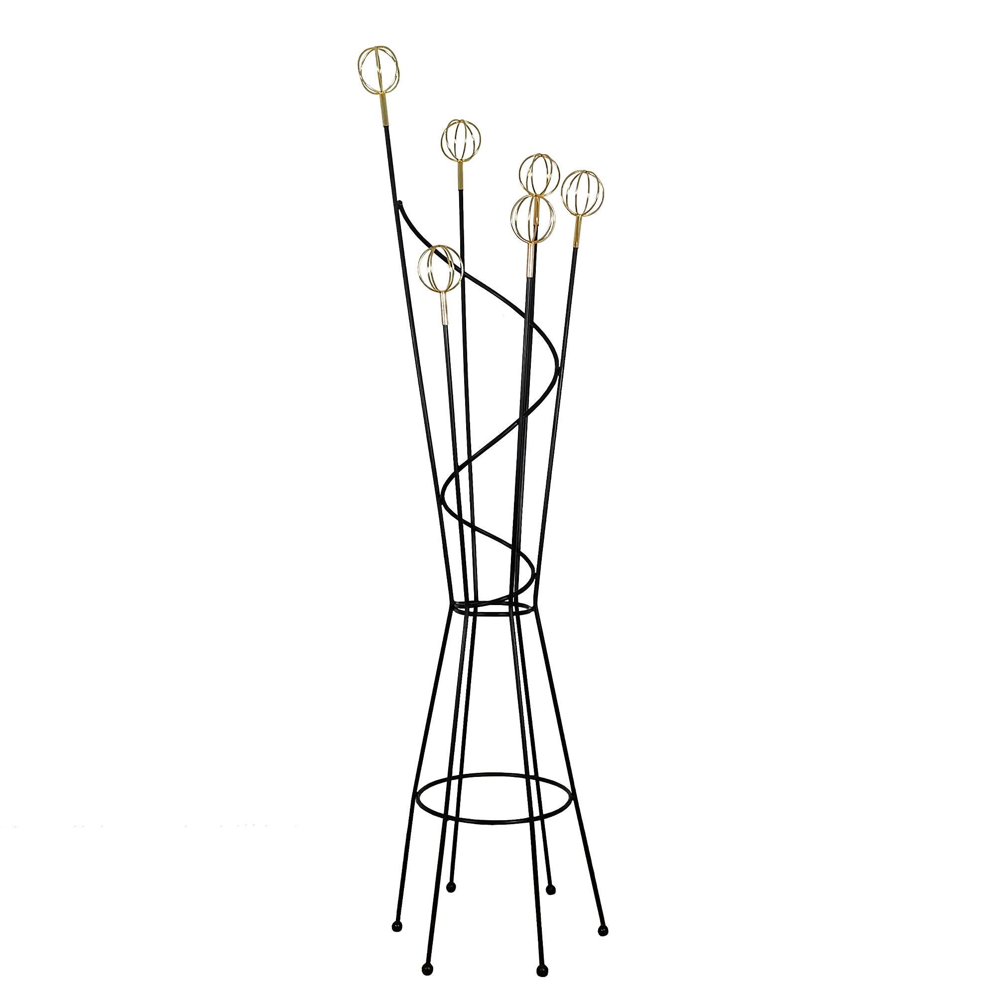 Coat rack in blackened steel rods ending in six brass-plated aluminum pegs.

Model: Geo Asgrolabe by Roger Feraud.

France c.1950.

 

cm: Diam 51 x 186

inches: Diam 20.07 x 72.23