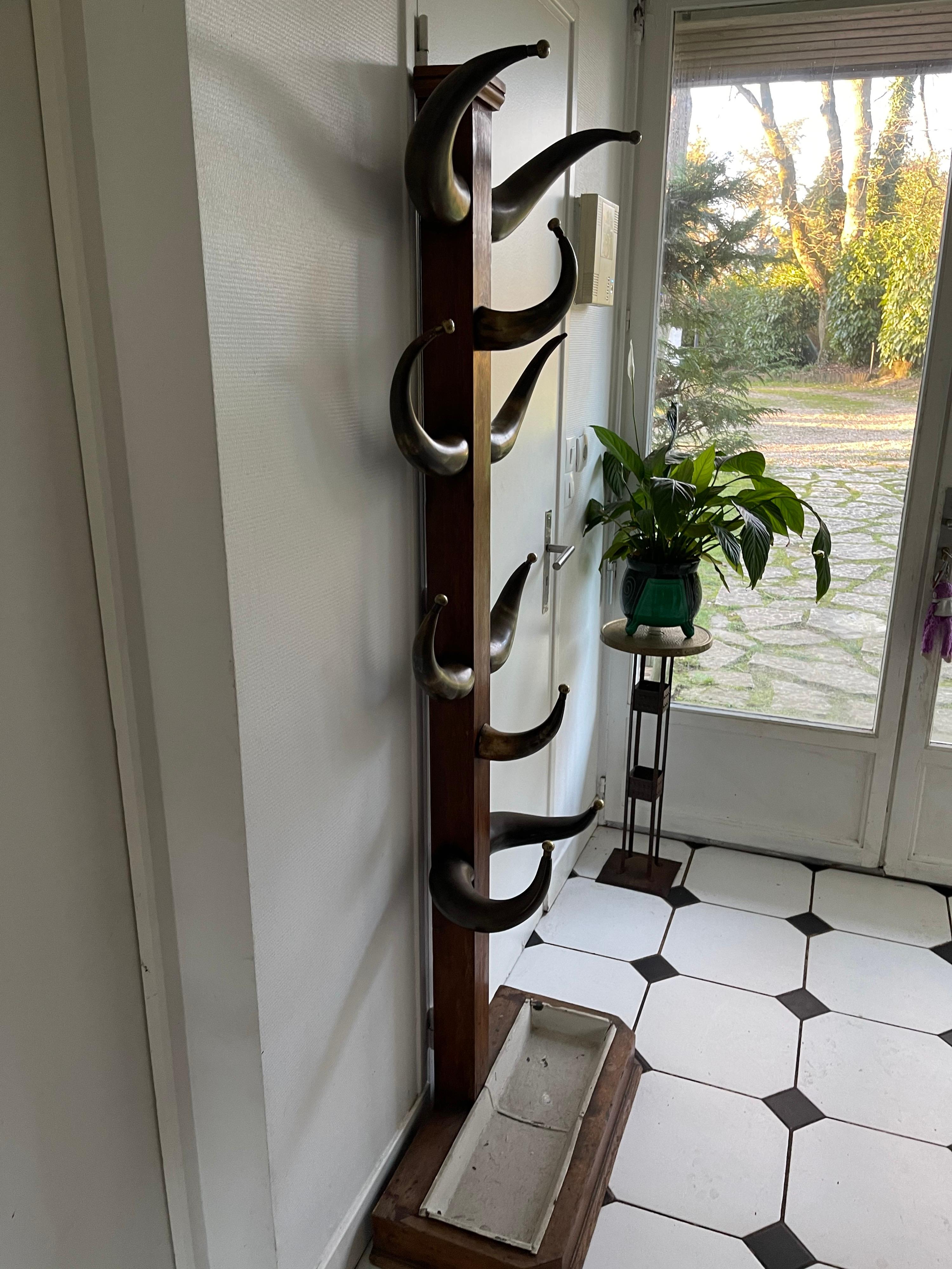 A 20th century coat rack horn and wood.
