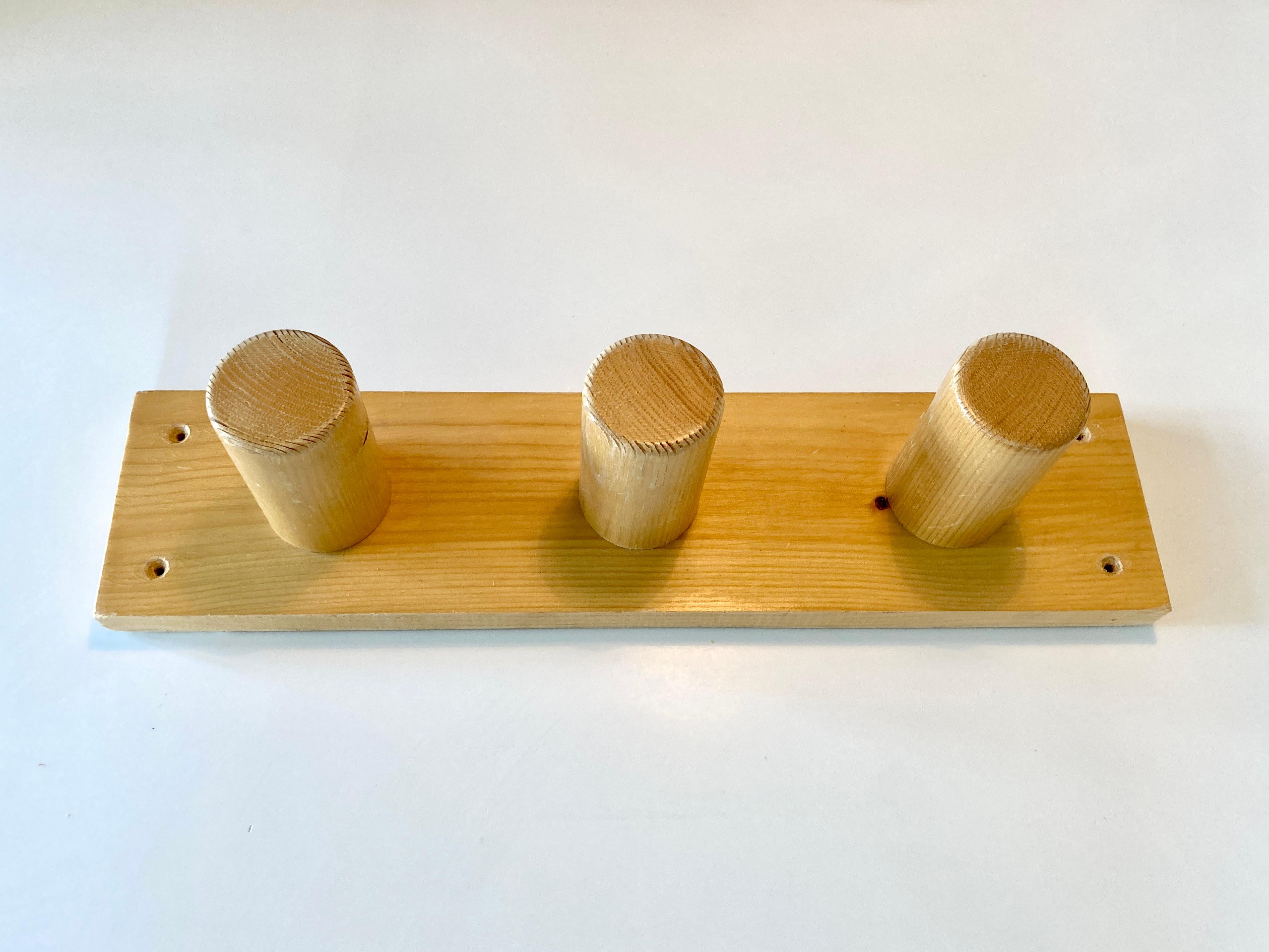Coat rack sourced from an apartment in Arc 1600, France.

Selected by Charlotte Perriand for Les Arcs, France, likely from the 1970s/early 80s.

Made of solid pine with 3 chunky pegs.

No damage, pegs are good and solid with no wobbles. Wood has a