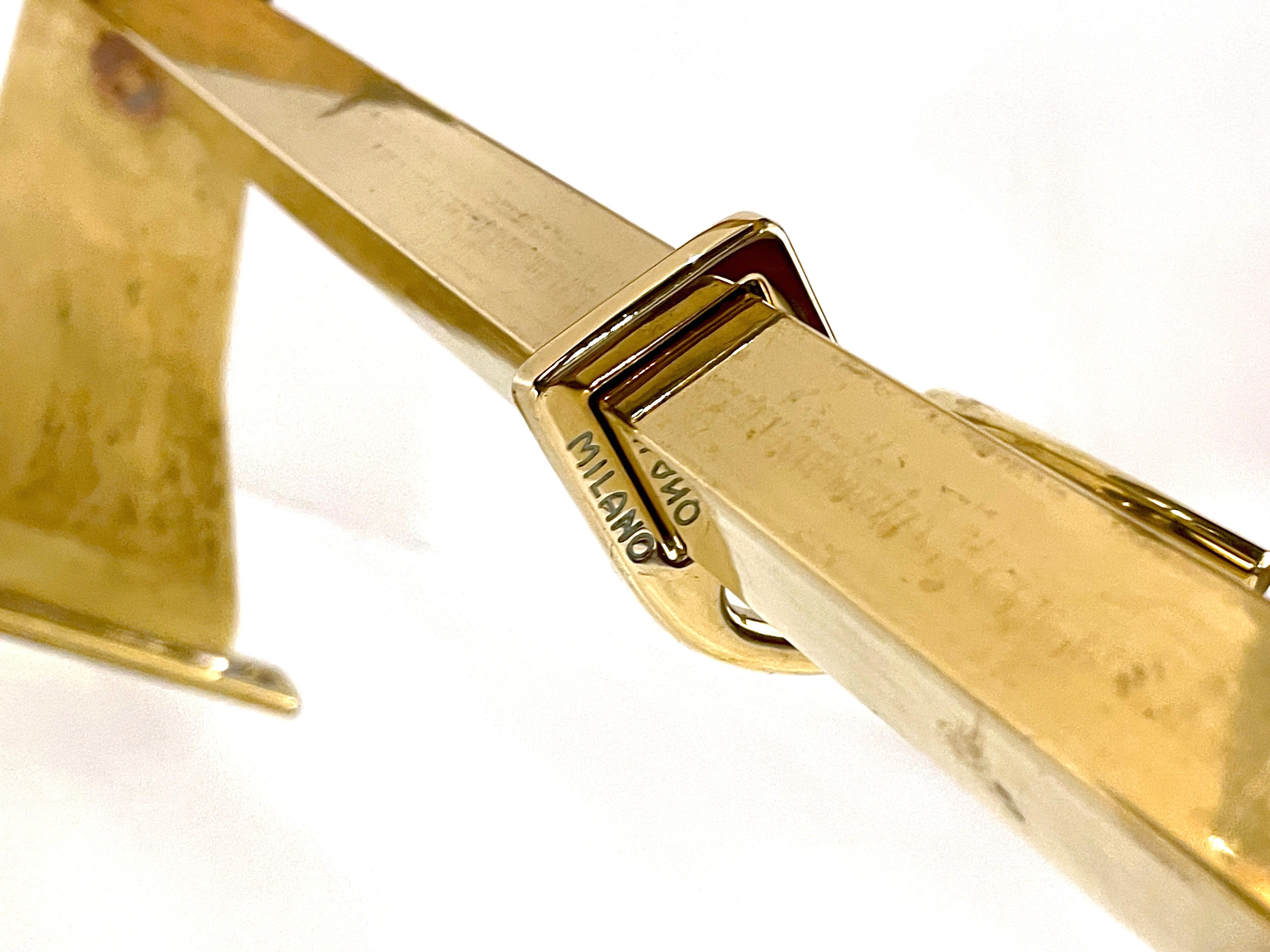 Coat Rack in solid brass with two types of hooks.

Italy 1950s.

 

Production period - 1950s.

Measures - Width 88 cm x Depth 15 cm x Height 25 cm.

Materials - Brass.

Color - Gold.

 

Condition of the article, comments - Good condition, some