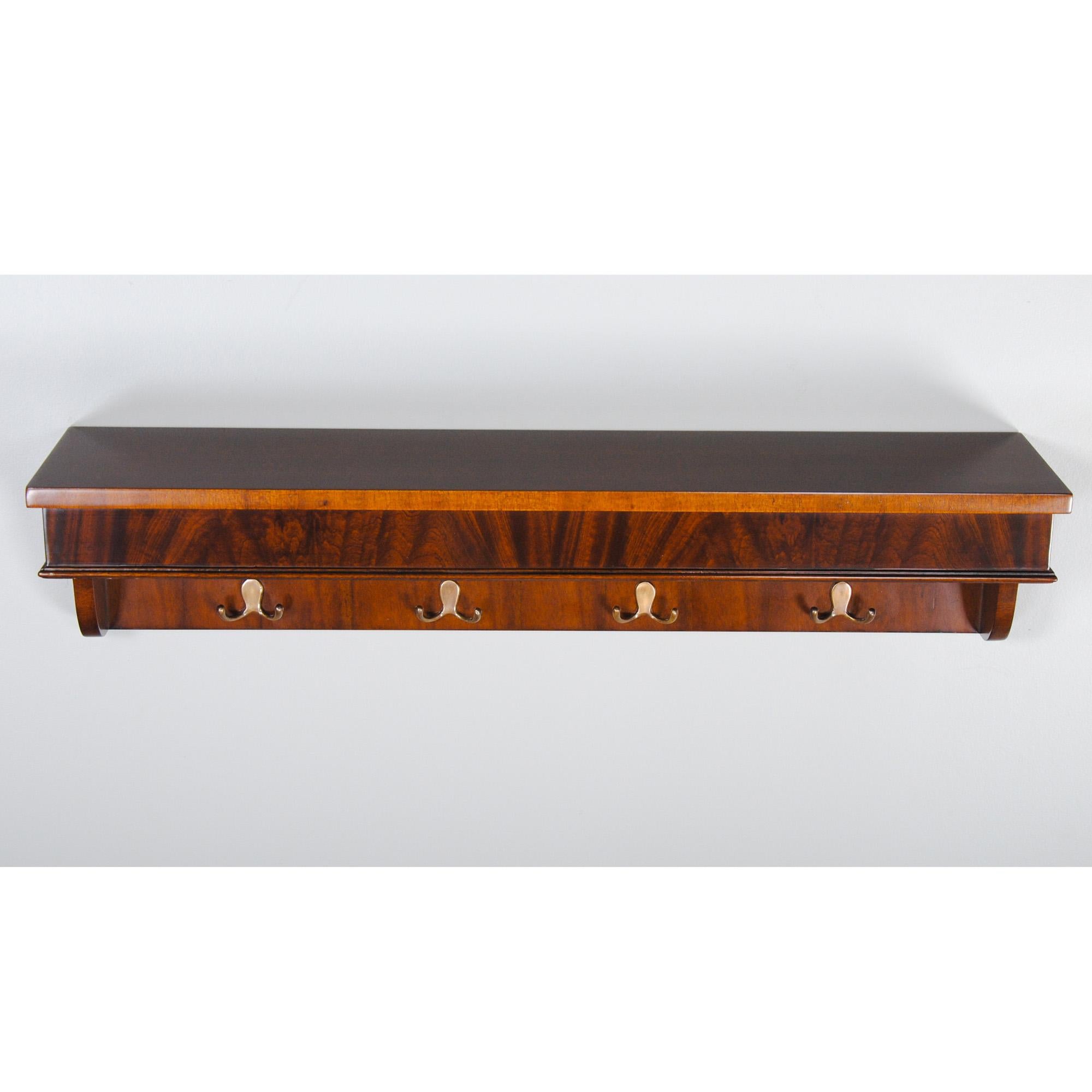 The Mahogany Coat Rack Shelf by Niagara Furniture is a great accessory that is both useful and decorative. Created from the finest mahogany solids and veneers the overall shape and style of the piece will fit in with almost any decor and add a