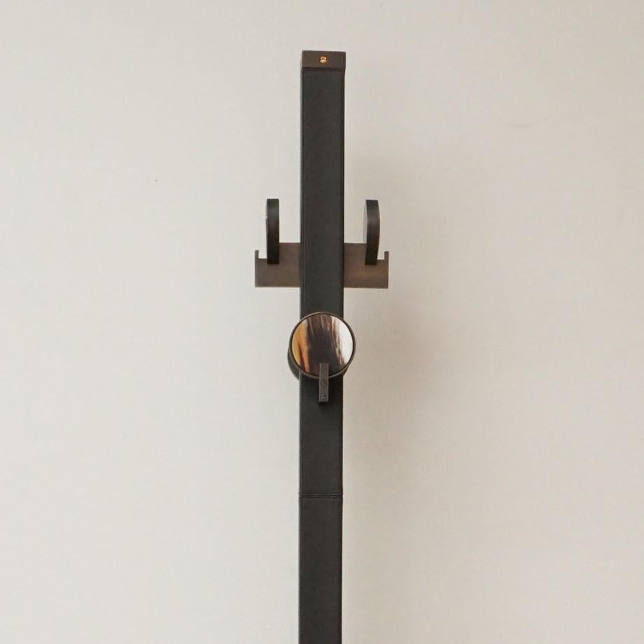 Arcahorn is an Italian company founded in 1958 by Mario Guerra. His family's company meticulously produces luxury decorative objects in zebu horn and other natural materials. This handsome coat stand is crafted in matte horn and brown leather with