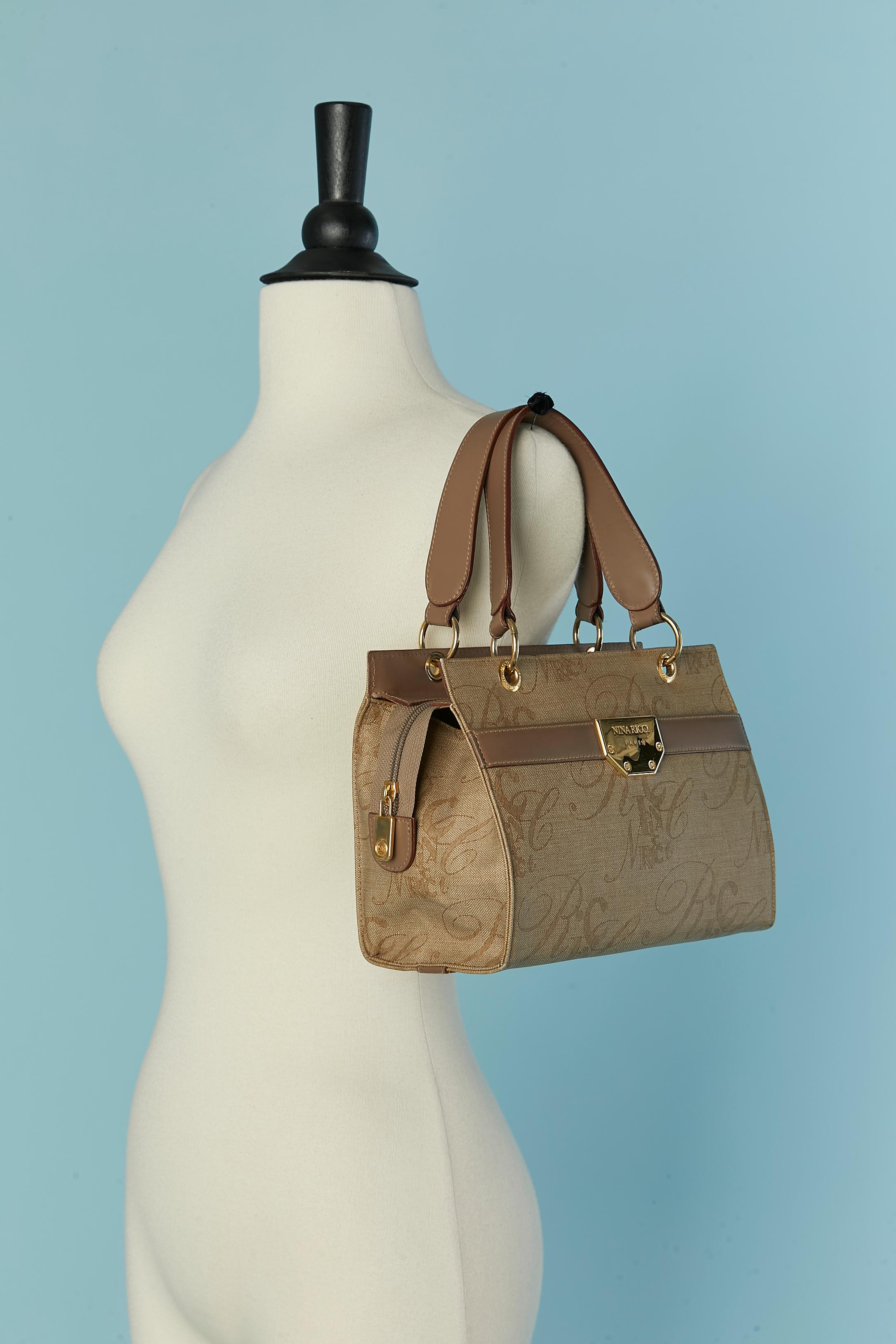 Coated and branded canevas and leather top handle bag Nina Ricci In Good Condition For Sale In Saint-Ouen-Sur-Seine, FR