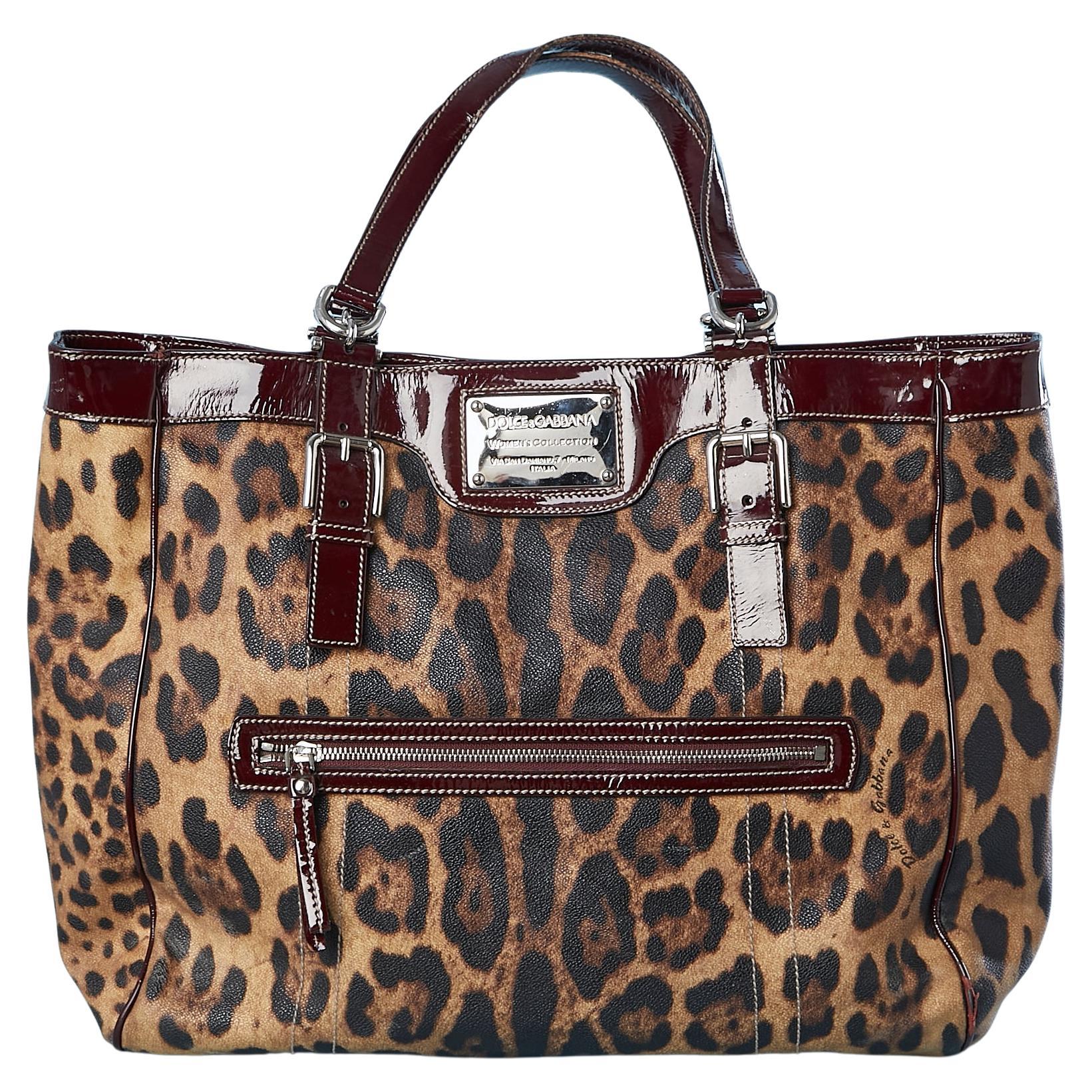 Dolce Gabbana - Manteau enduite léopard imprimé canevas et détails en cuir bordeaux 